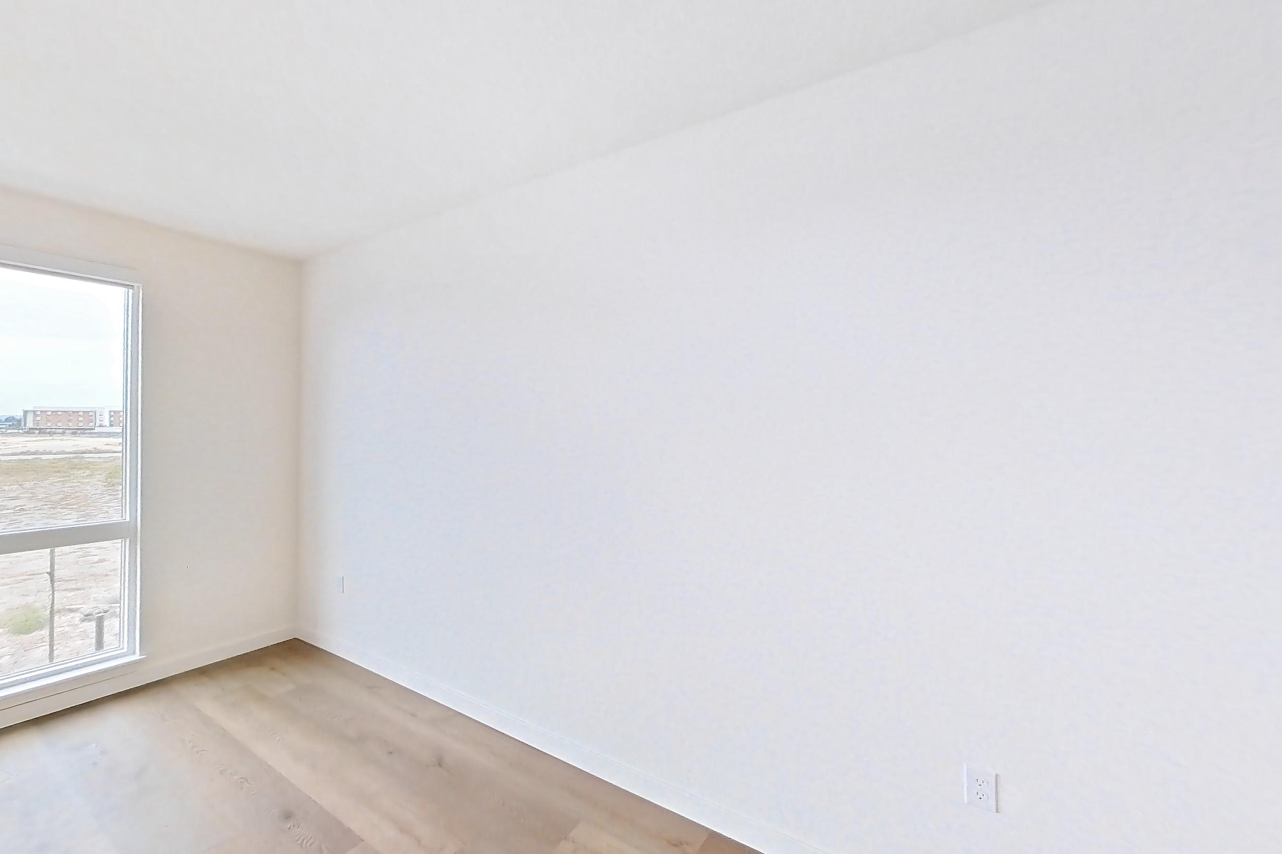 Living room with light wood-finish flooring, Apartment 1409 at VAYA on Axia
