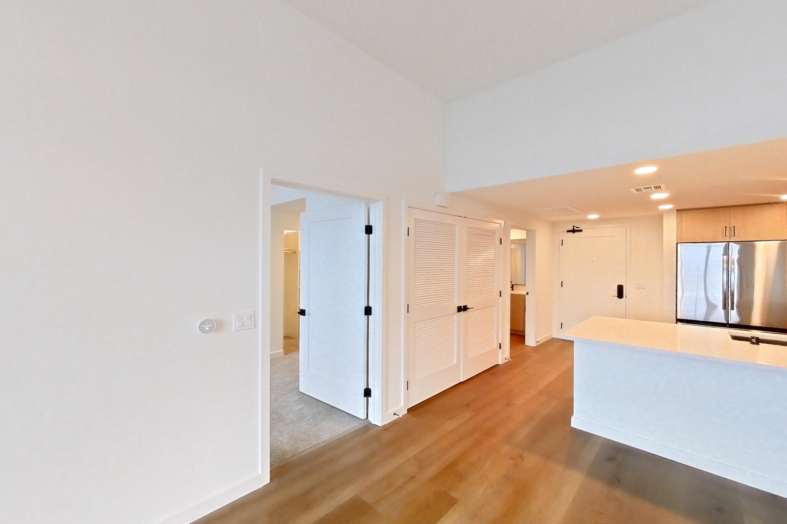Living room with light wood-finish flooring, Apartment 1426 at VAYA on Axia