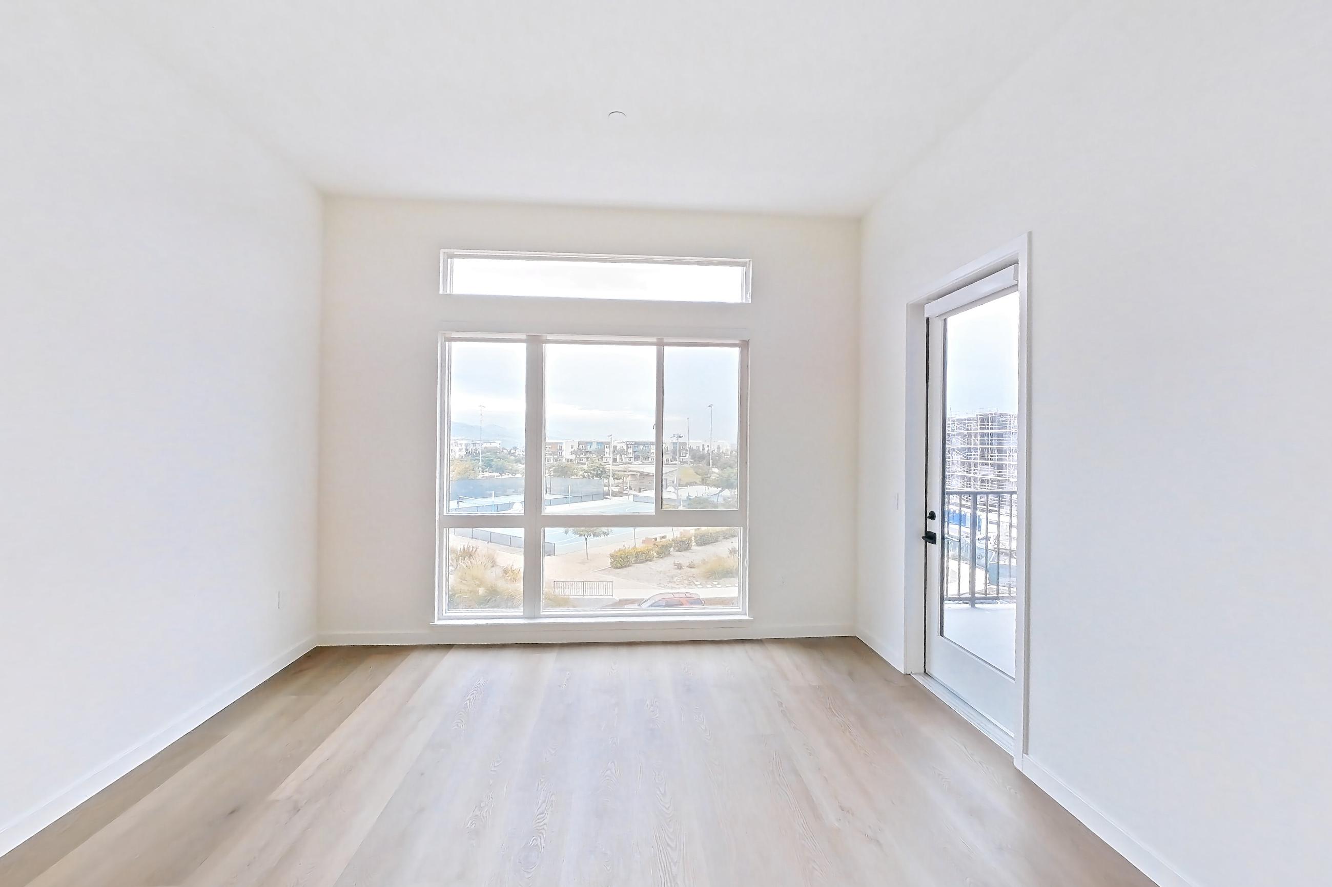 Living room with light wood-finish flooring, Apartment 1428 at VAYA on Axia