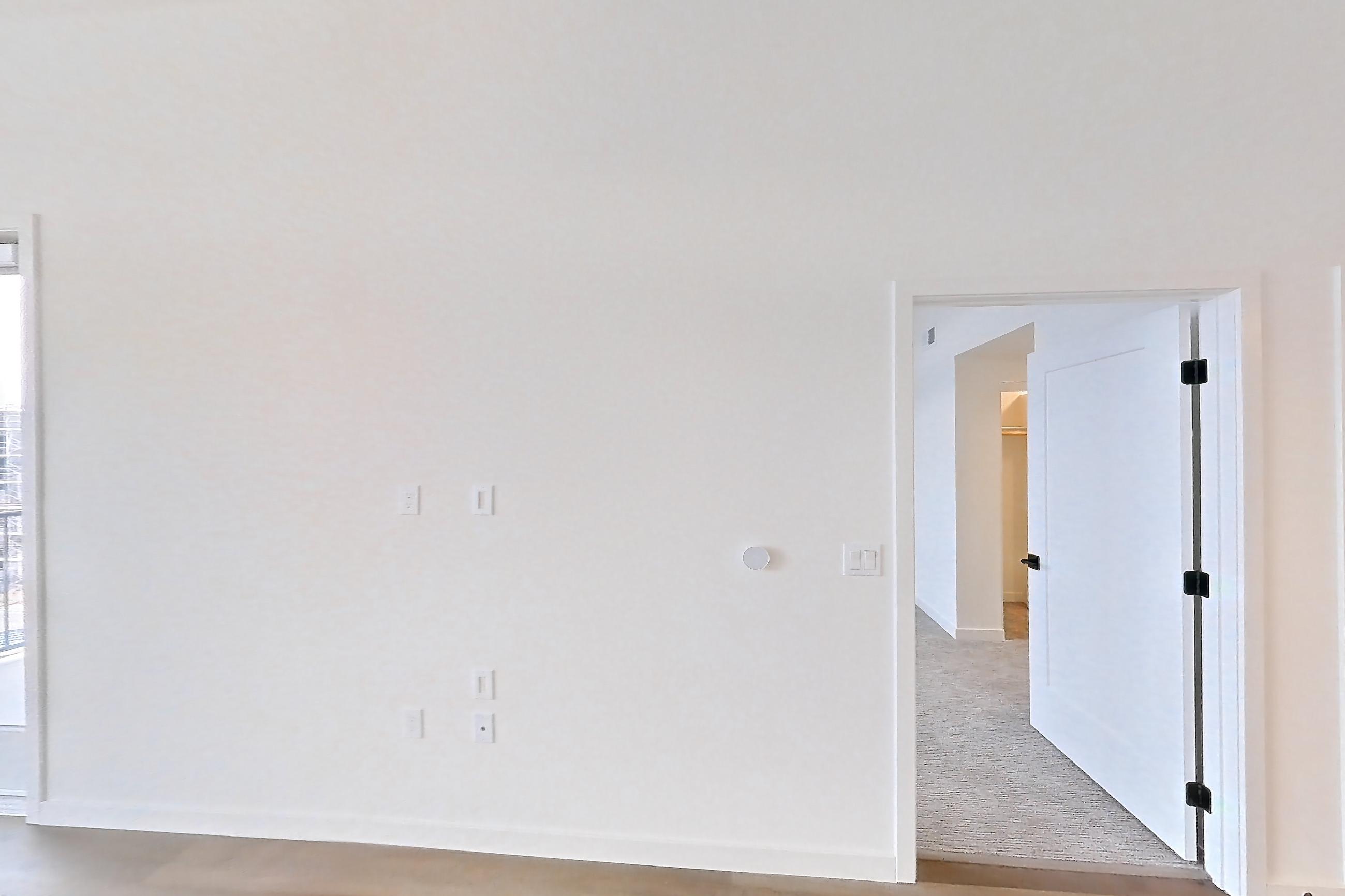 Living room with light wood-finish flooring, Apartment 1430 at VAYA on Axia