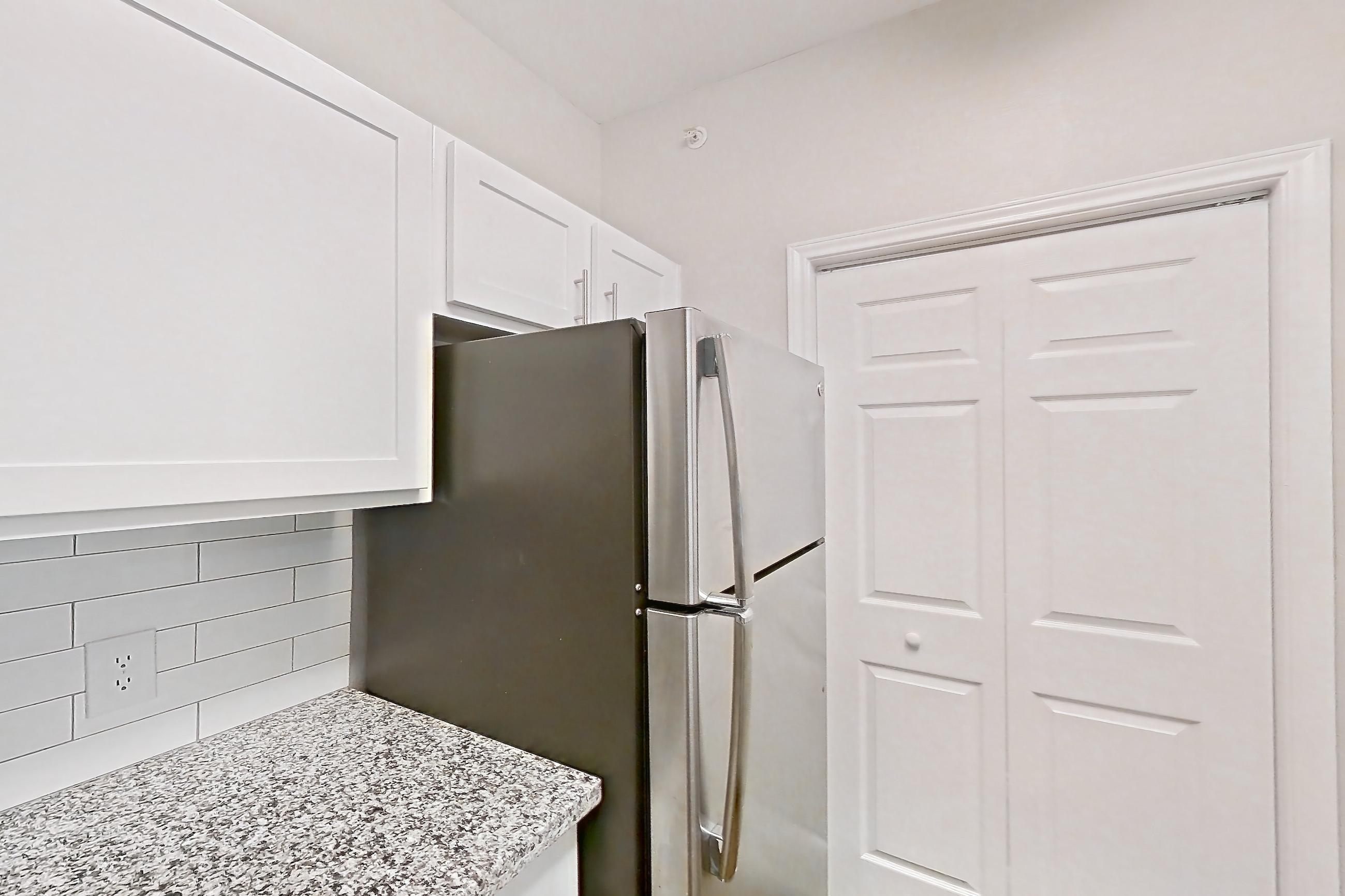 Kitchen in a 1B floor plan apartment, representative of Apartment 0823 at Reserve at Kingwood