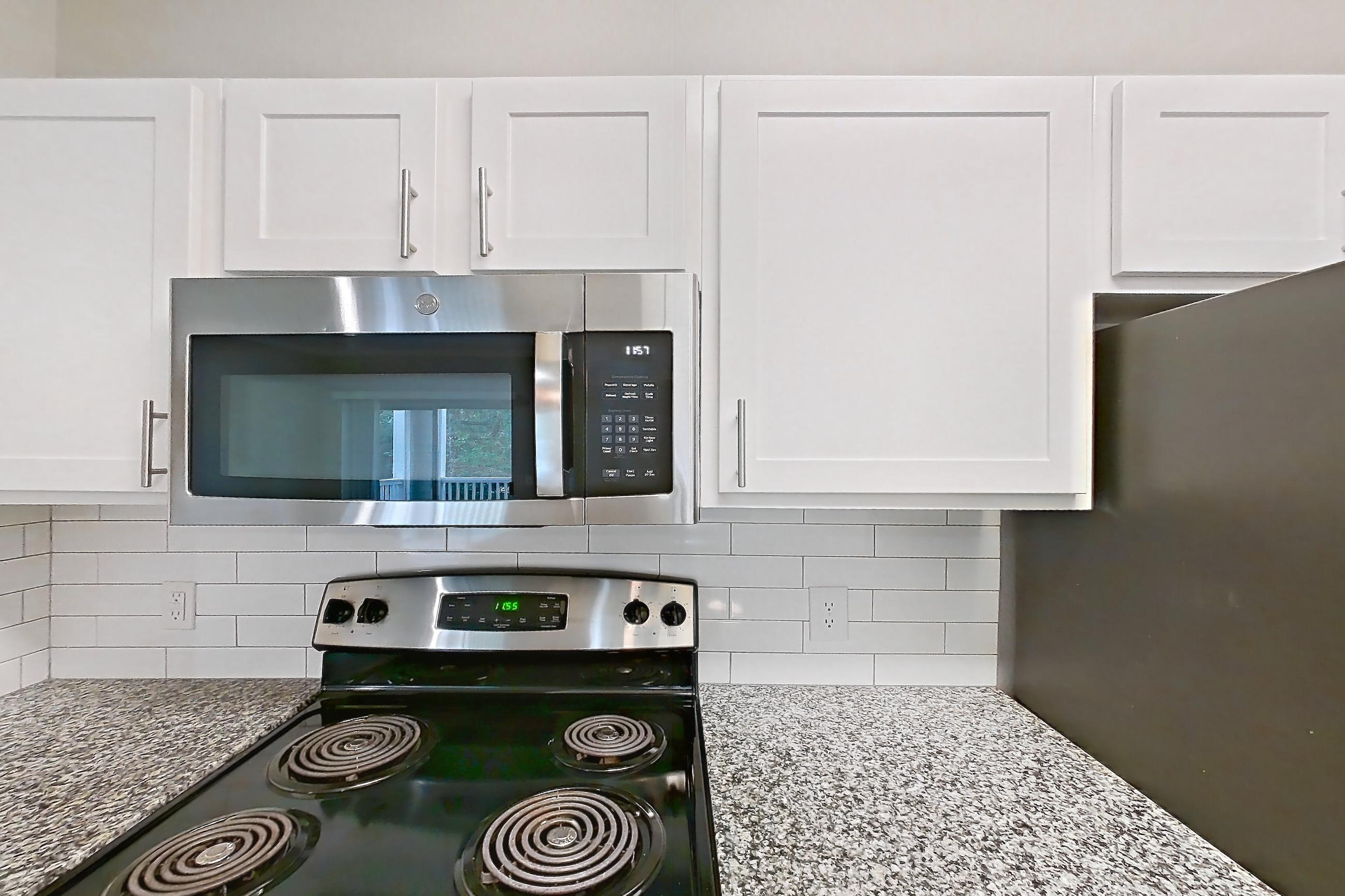 Kitchen in a 1B floor plan apartment, representative of Apartment 0823 at Reserve at Kingwood