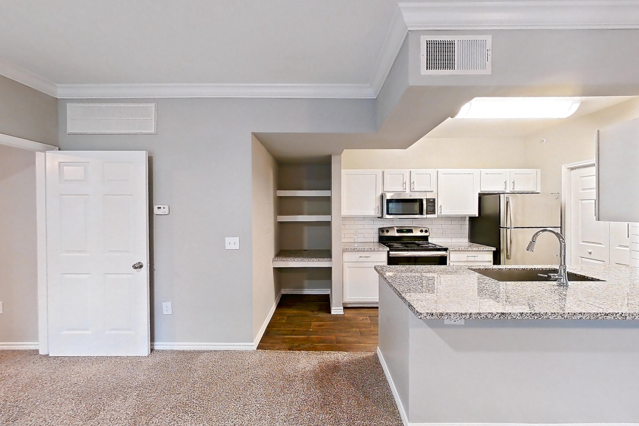 Living room in a 1B floor plan apartment, representative of Apartment 0823 at Reserve at Kingwood