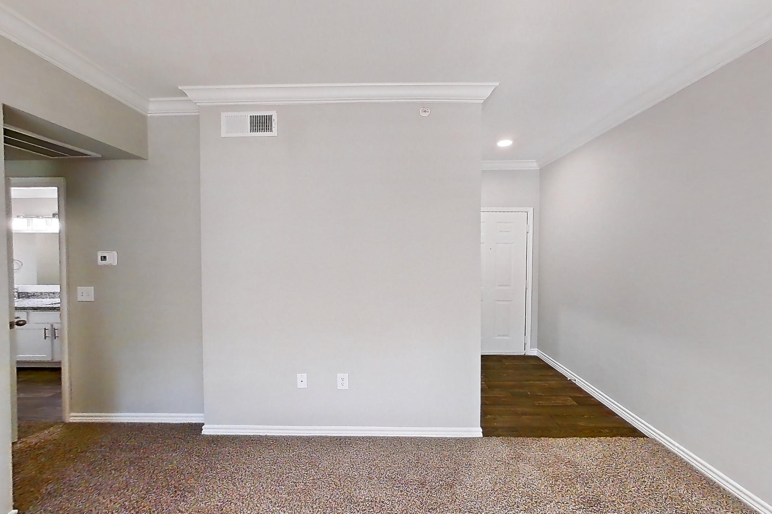 Living room with electric range, kitchen island, light stone countertops, oven/range, and stainless steel appliances, Apartment 0535 at Reserve at Kingwood