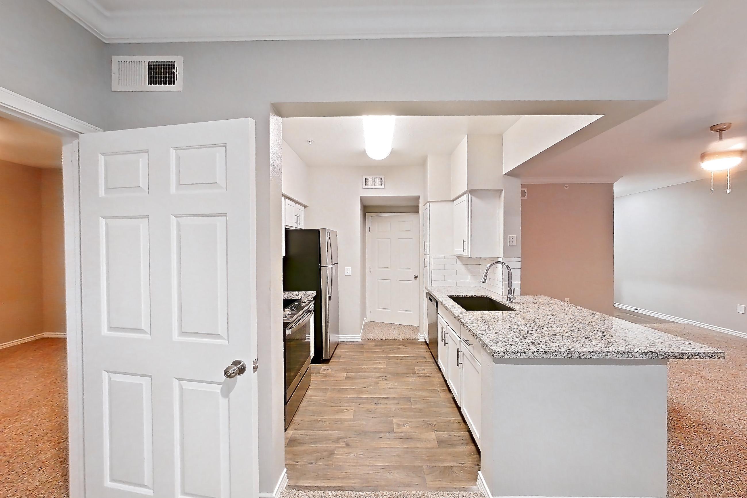 Dining room with dishwasher, oven/range, refrigerator, and stainless steel appliances, Apartment 0920 at Reserve at Kingwood