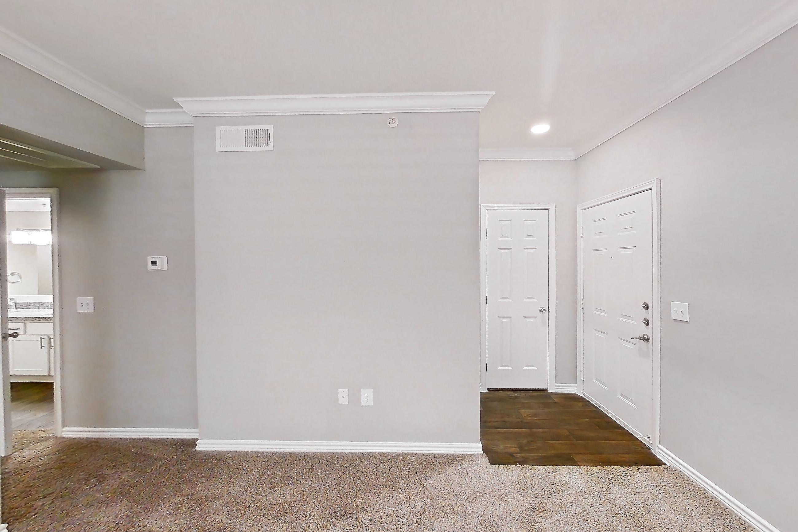 Living room with dark carpet, electric range, light carpet, light stone countertops, oven/range, and stainless steel appliances, Apartment 1121 at Reserve at Kingwood