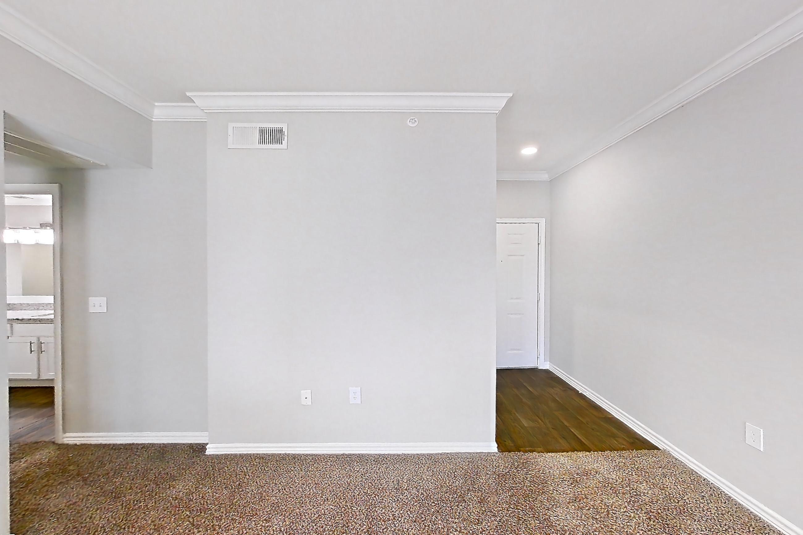 Living room with dark carpet, electric range, kitchen island, light carpet, light stone countertops, oven/range, and stainless steel appliances, Apartment 1230 at Reserve at Kingwood