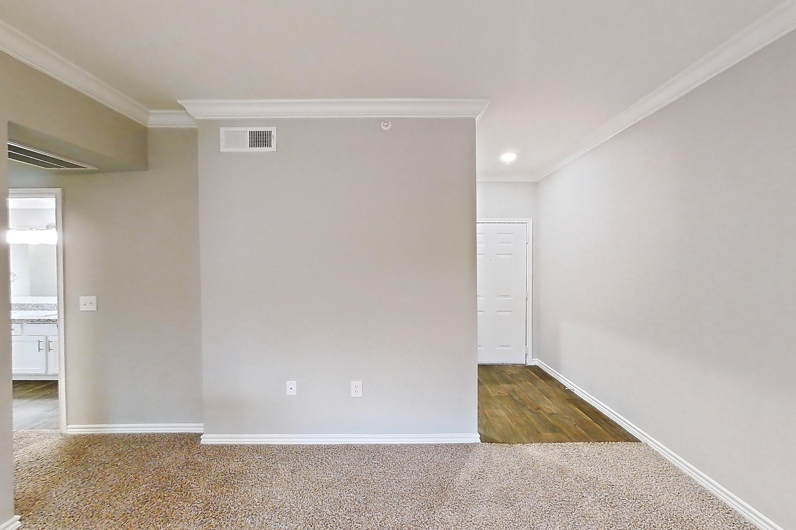 Living room with oven/range and stainless steel appliances, Apartment 0435 at Reserve at Kingwood