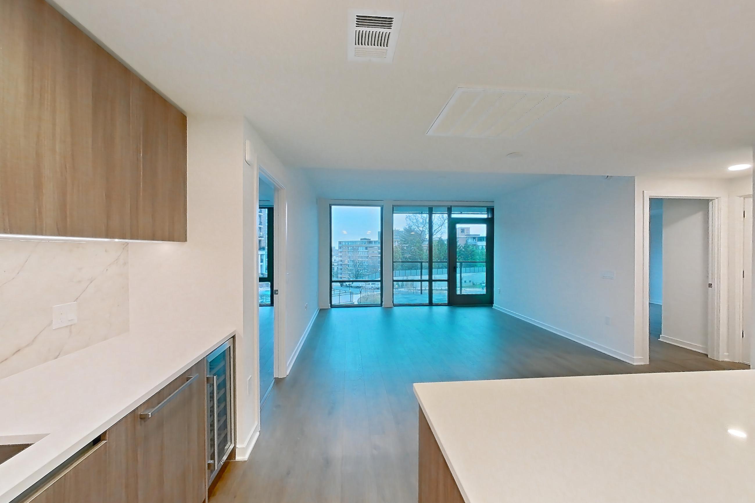 Kitchen with gas range, light stone countertops, light tile flooring, light wood-finish flooring, oven/range, stainless steel appliances, and wood-finish flooring, Apartment 0320 at Aerie