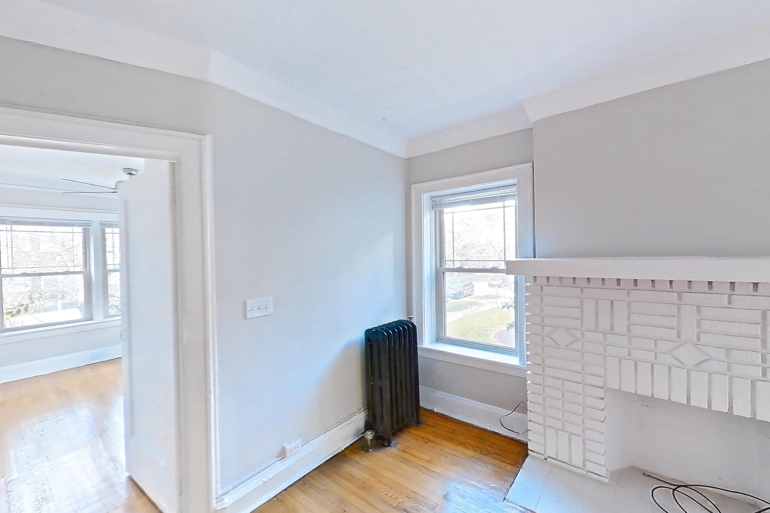 Living room with radiator heat, Apartment 42-02 at Integrity Cleveland Heights