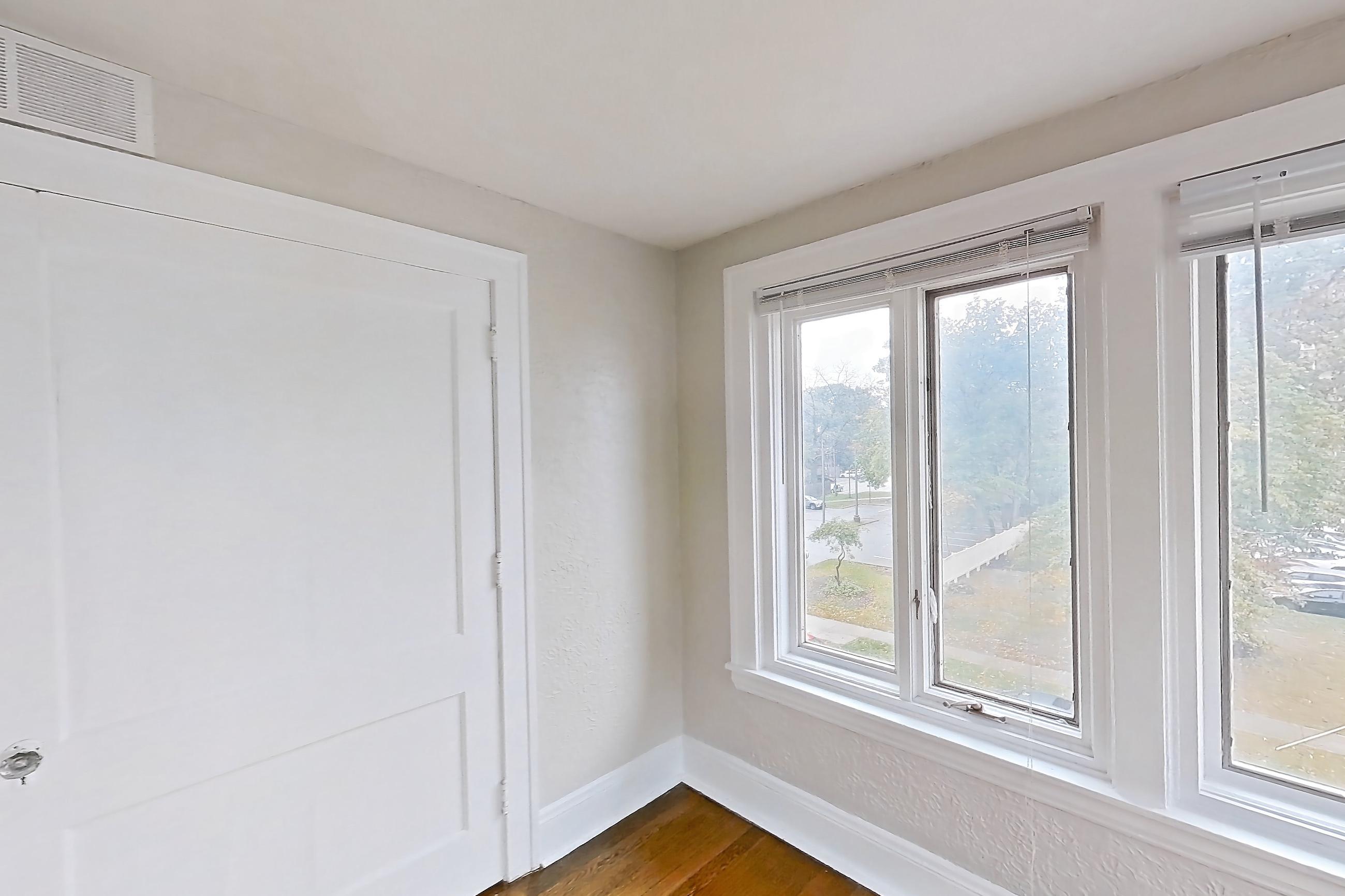 Living space with light wood-finish flooring, Apartment 5 at Integrity Cleveland Heights