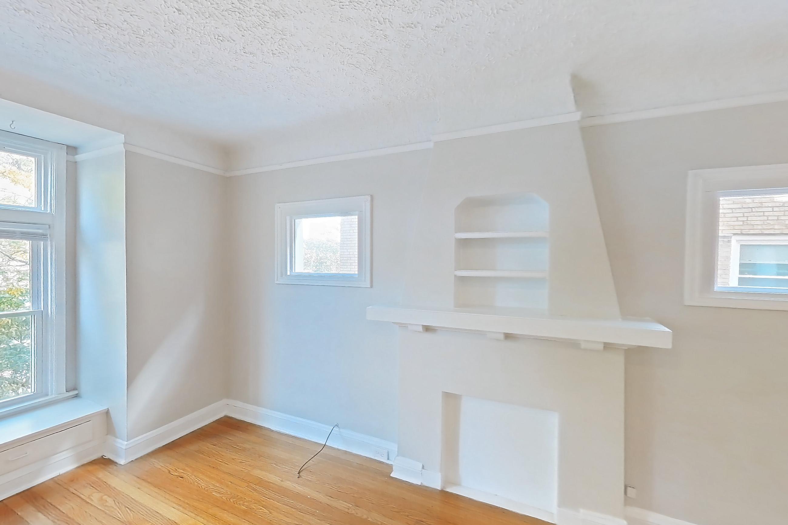 Living room with light wood-finish flooring and wood-finish flooring, Apartment 302 at Integrity Gold Coast