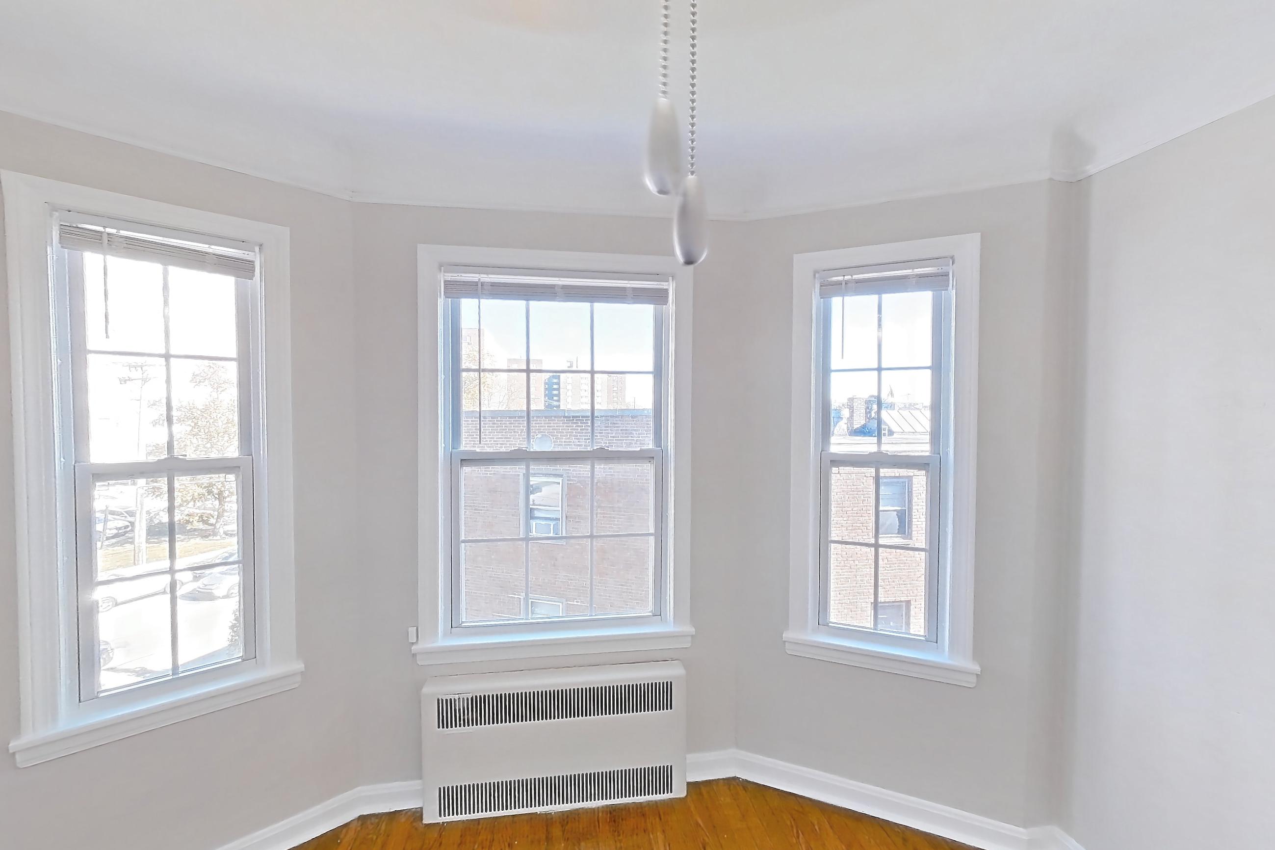 Dining room with dark wood-finish flooring and wood-finish flooring, Apartment 302 at Integrity Gold Coast