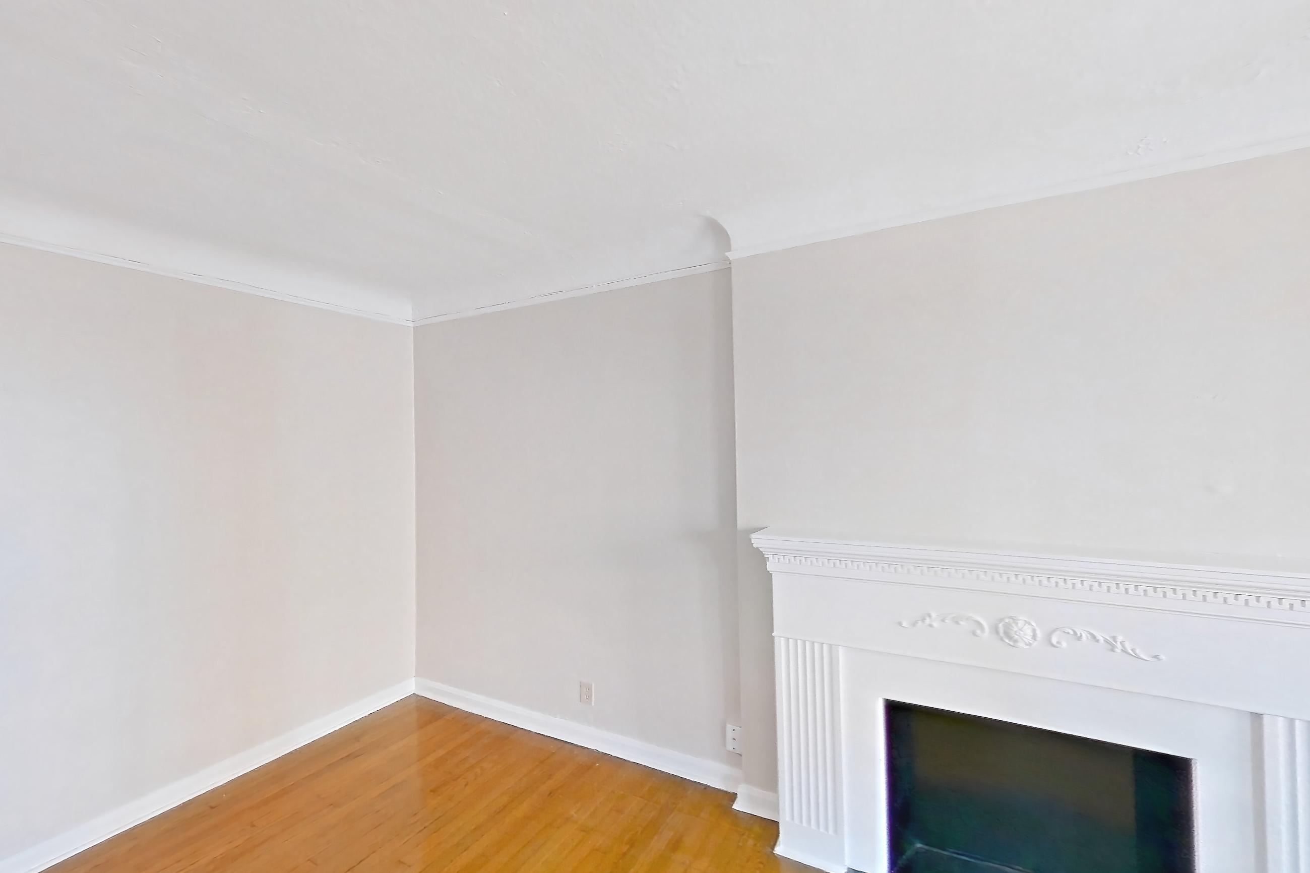 Living room with fireplace, light wood-finish flooring, and wood-finish flooring, Apartment 302 at Integrity Gold Coast