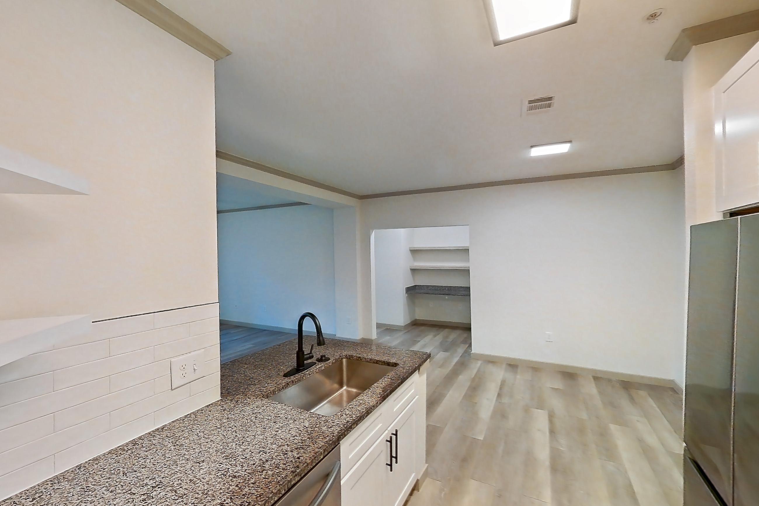 Kitchen in Apartment 14-103 at Cortland Westminster, B4R - Frisco floor plan