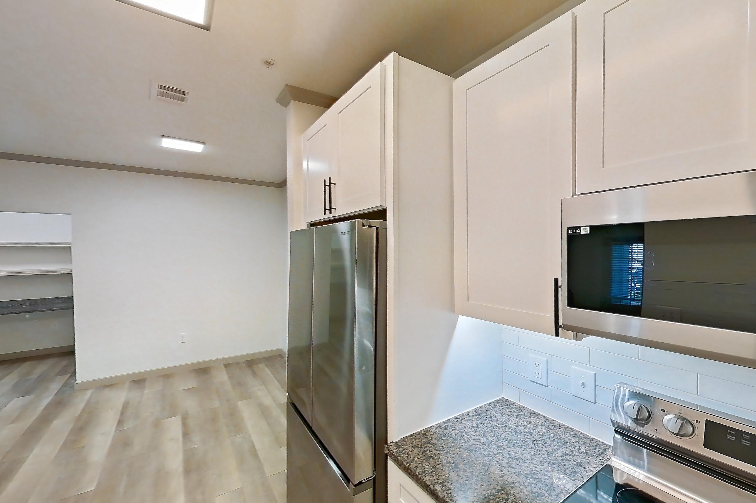 Kitchen in Apartment 14-103 at Cortland Westminster, B4R - Frisco floor plan