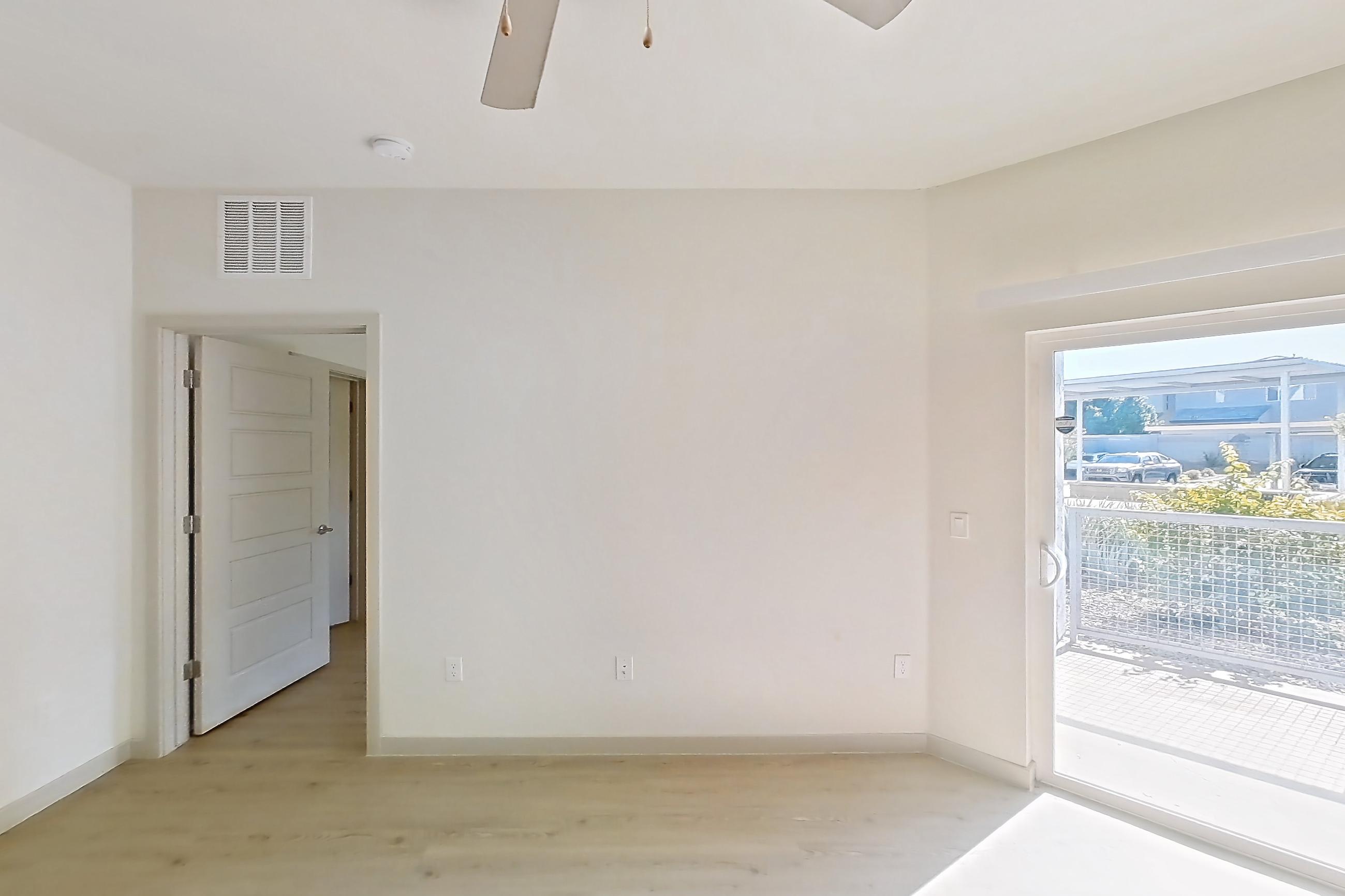 Living room with light wood-finish flooring, Apartment 1097 at Cortland at P83