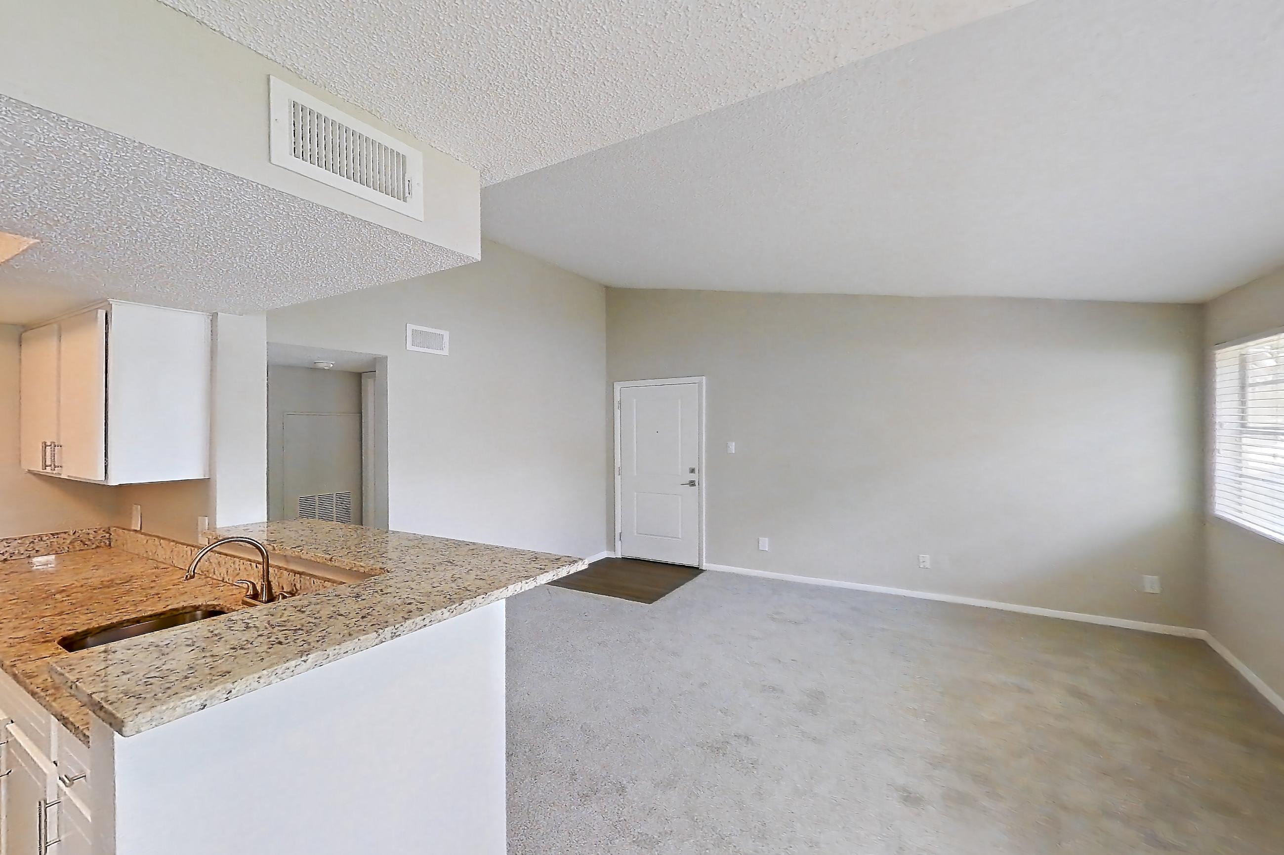 Living space with light carpet and water view, Apartment 1710 at Cortland at the Hammocks