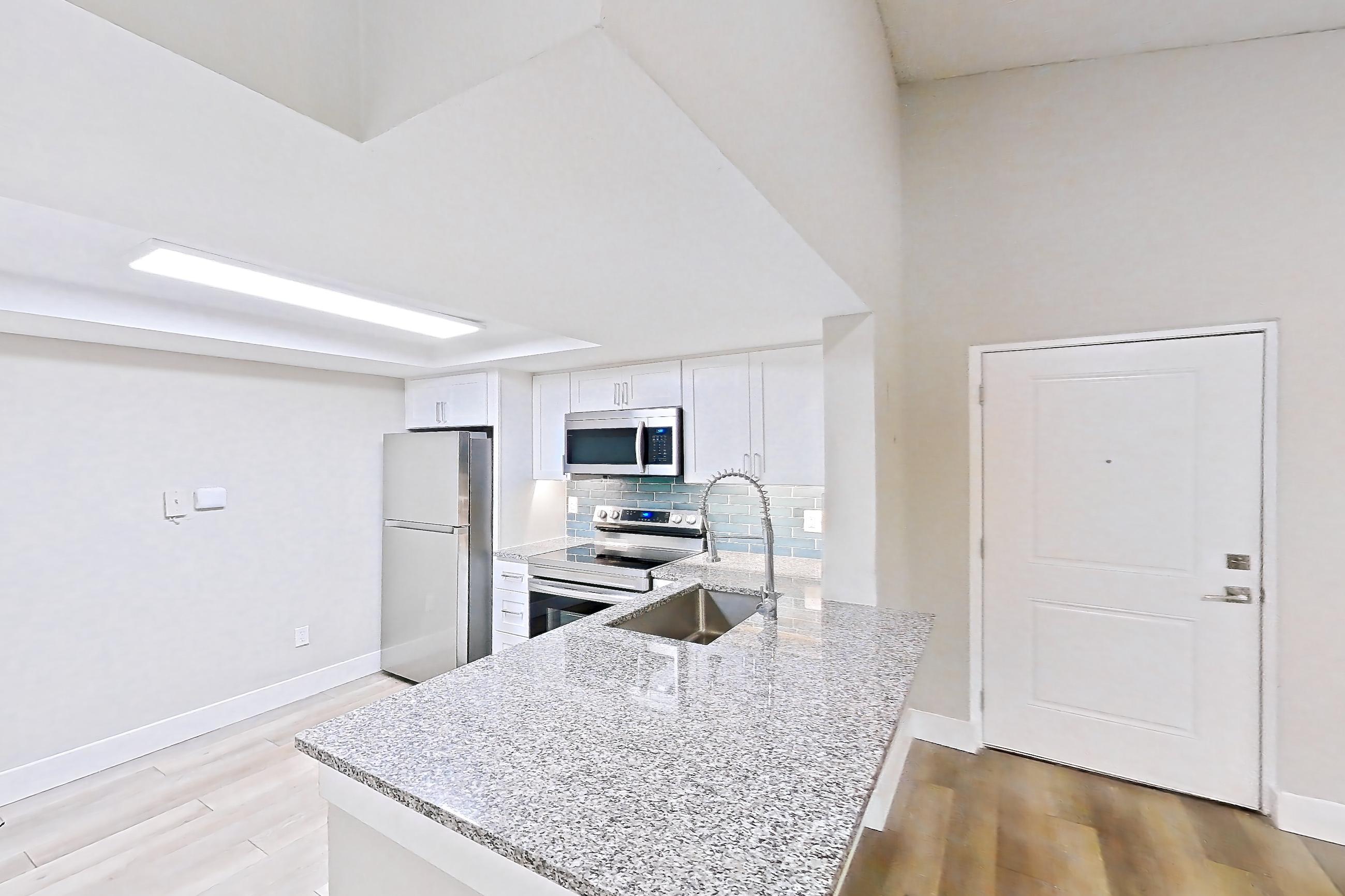 Kitchen entryway in Apartment 07-034 at Cortland at the Hammocks, A7R - Laurel Oak - W floor plan