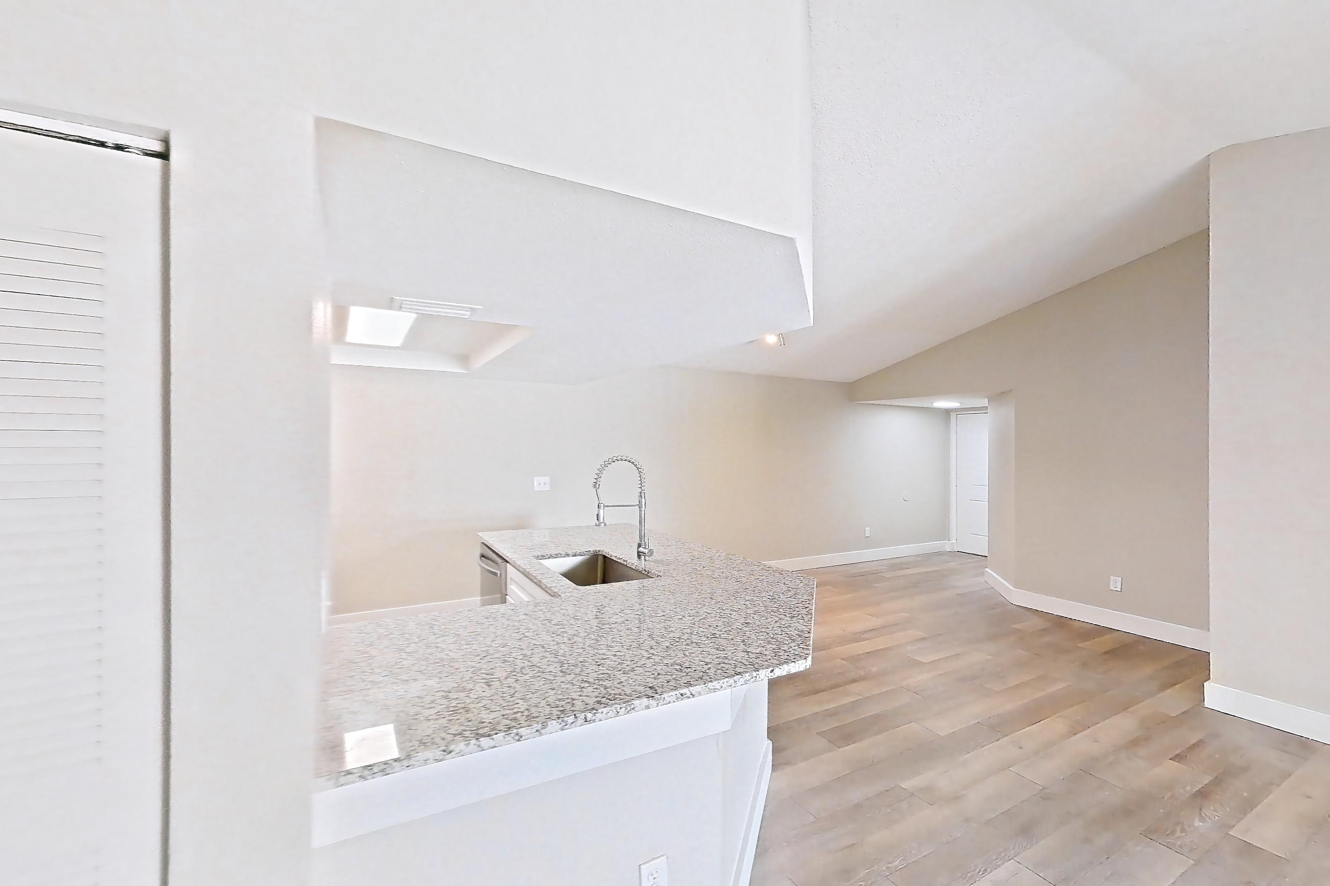 Living room side in Apartment 10-032 at Cortland at the Hammocks, C1R - Sycamore - W floor plan