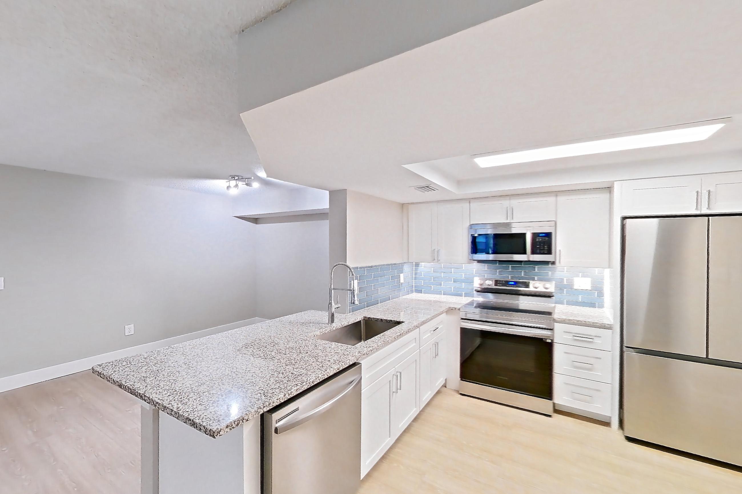 Kitchen entryway in Apartment 10-024 at Cortland at the Hammocks, C2R - Wax Myrtle - W floor plan