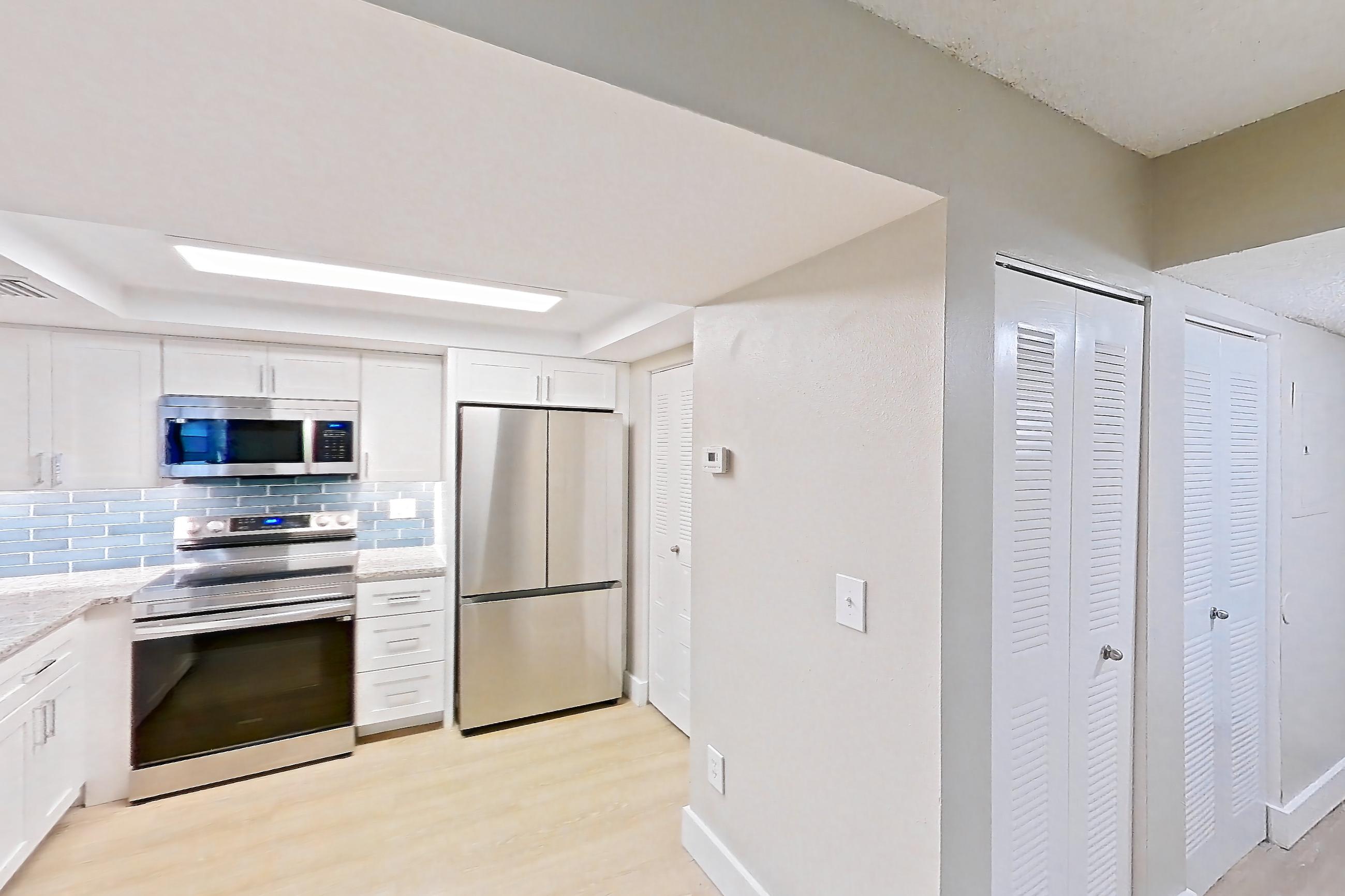 Kitchen entryway in Apartment 10-024 at Cortland at the Hammocks, C2R - Wax Myrtle - W floor plan