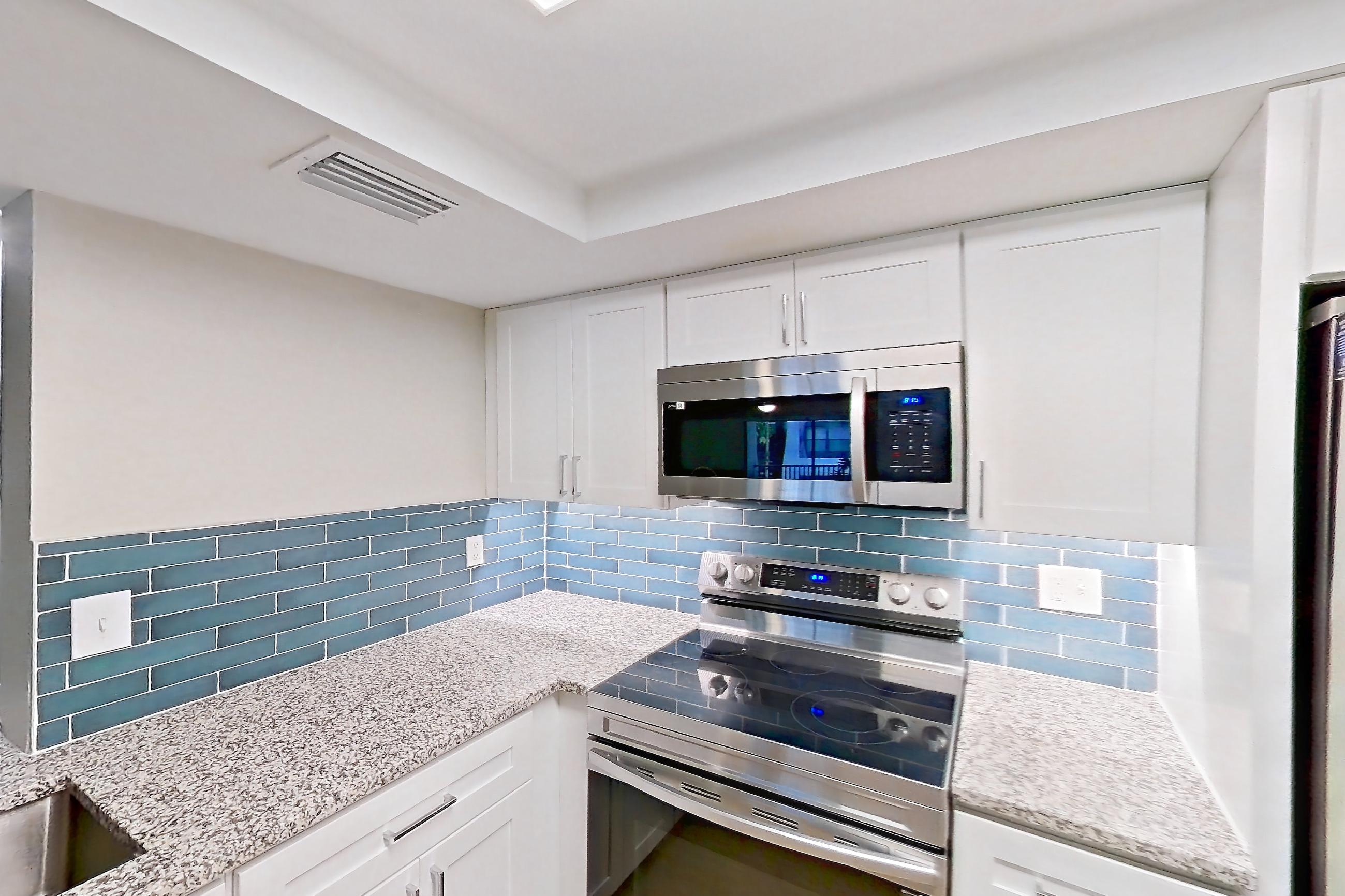 Kitchen in Apartment 10-024 at Cortland at the Hammocks, C2R - Wax Myrtle - W floor plan