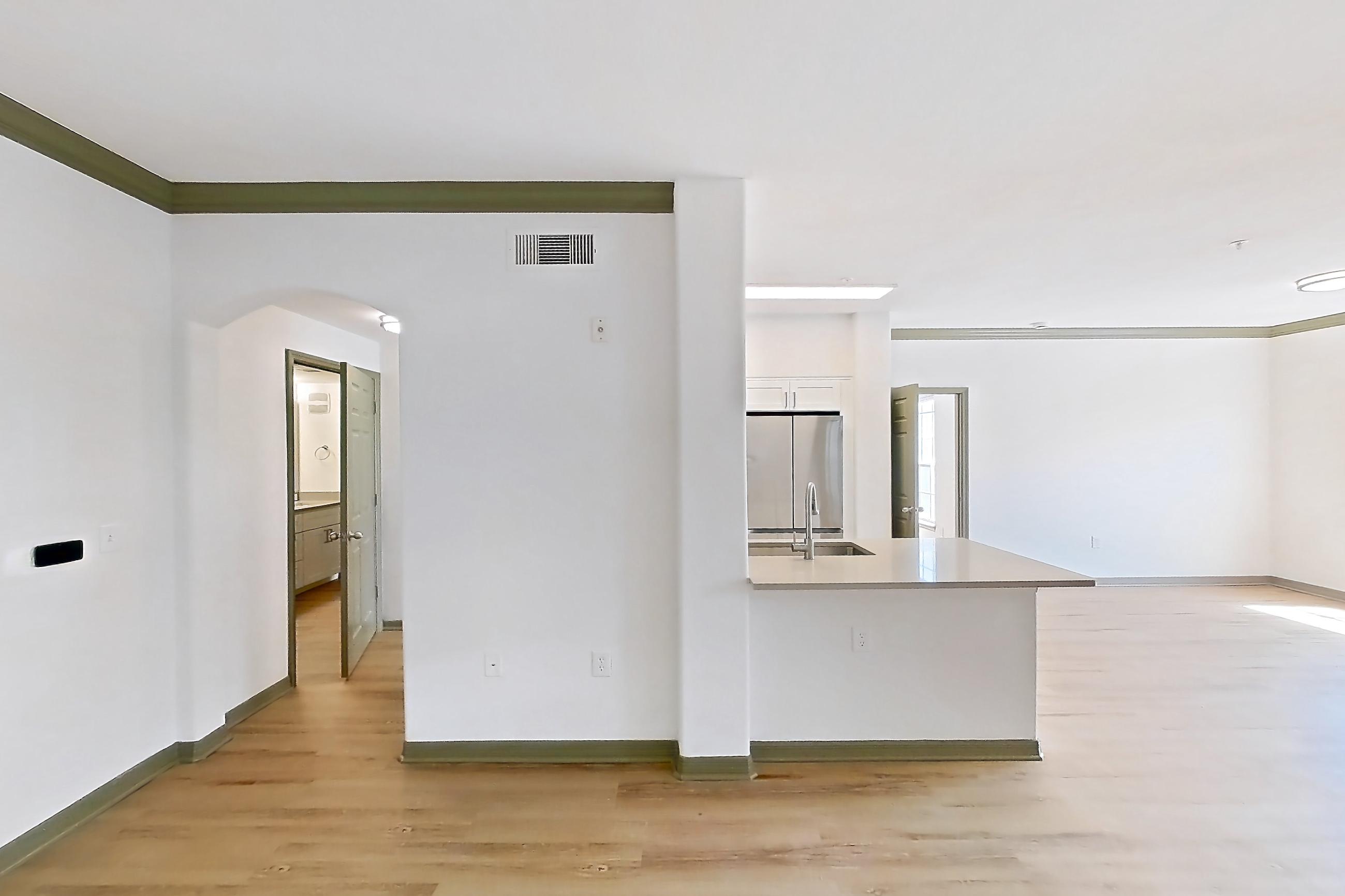 Living space with light countertops and light wood-finish flooring, Apartment 12309 at Cortland Lakecrest