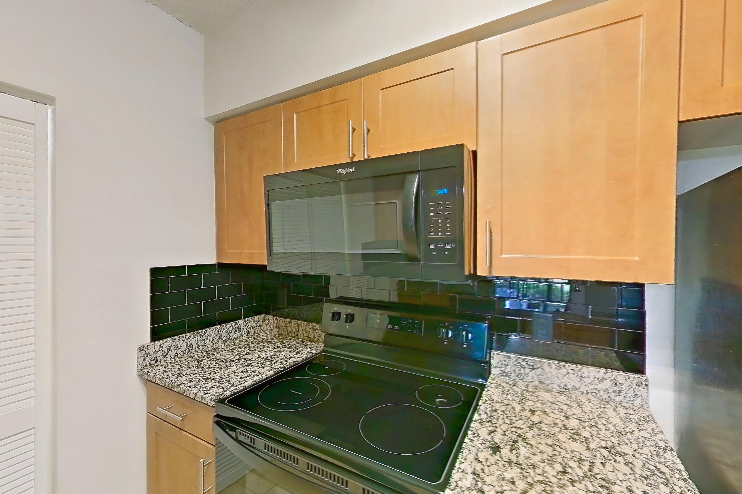 Kitchen in Apartment 525318 at Cortland Bayport, B11 - Lagoon South 1 floor plan