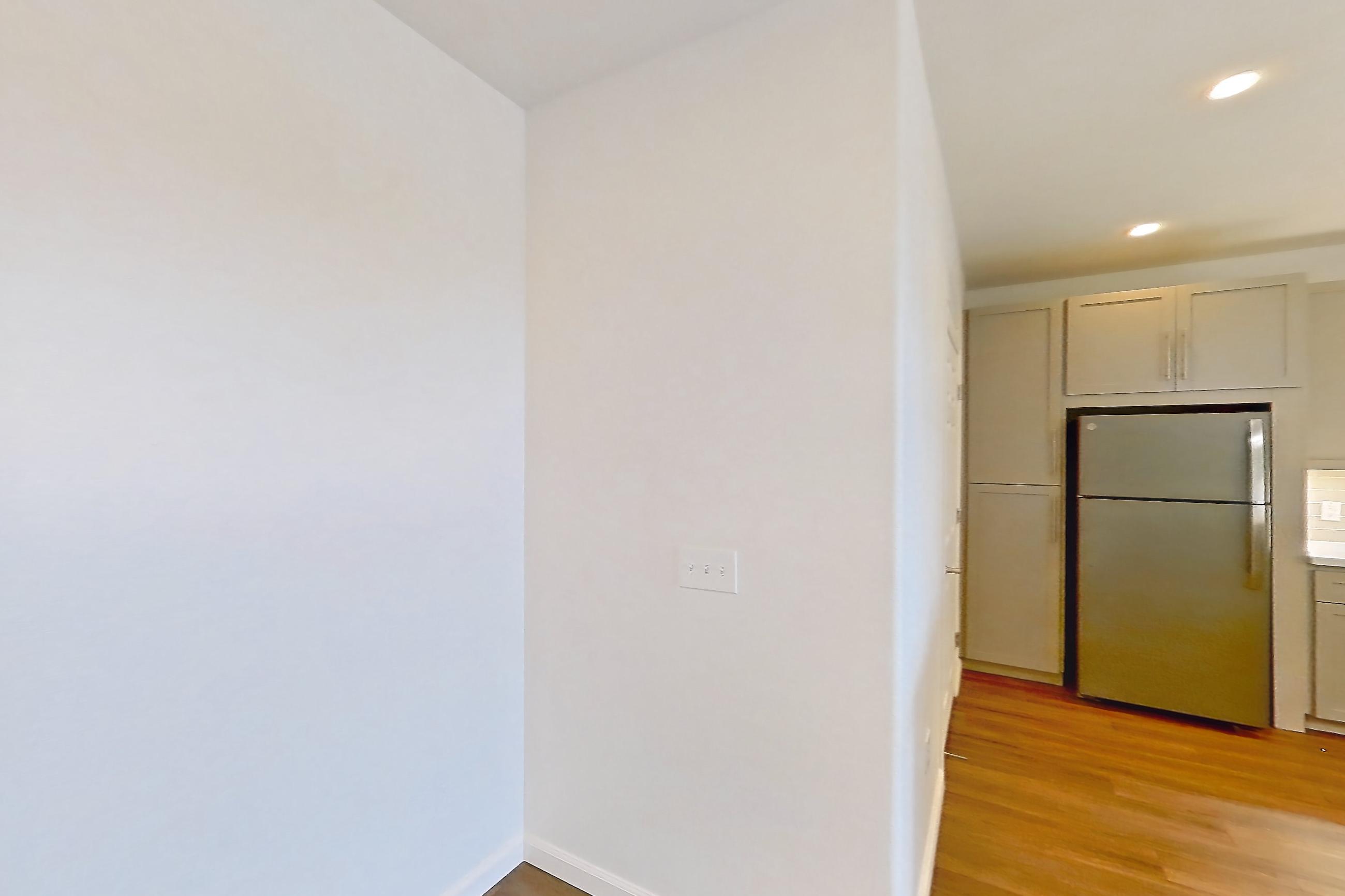 Dining room with dark wood-finish flooring, electric range, light countertops, light stone countertops, oven/range, refrigerator, and stainless steel appliances, Apartment 3091 at Cortland South Mountain