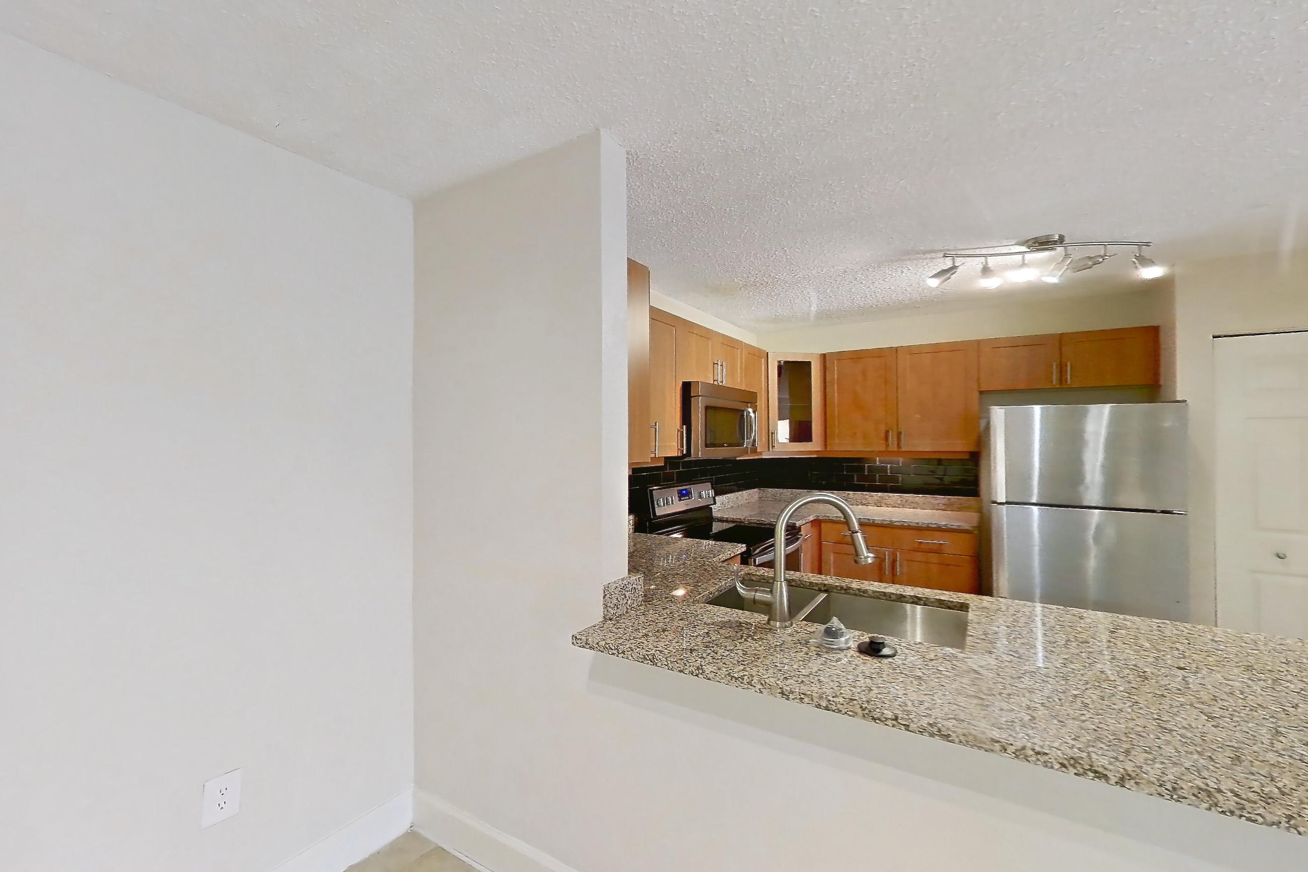 Dining room with electric range, light countertops, light stone countertops, light tile flooring, oven/range, refrigerator, and stainless steel appliances, Apartment 475441 at Cortland Bayport