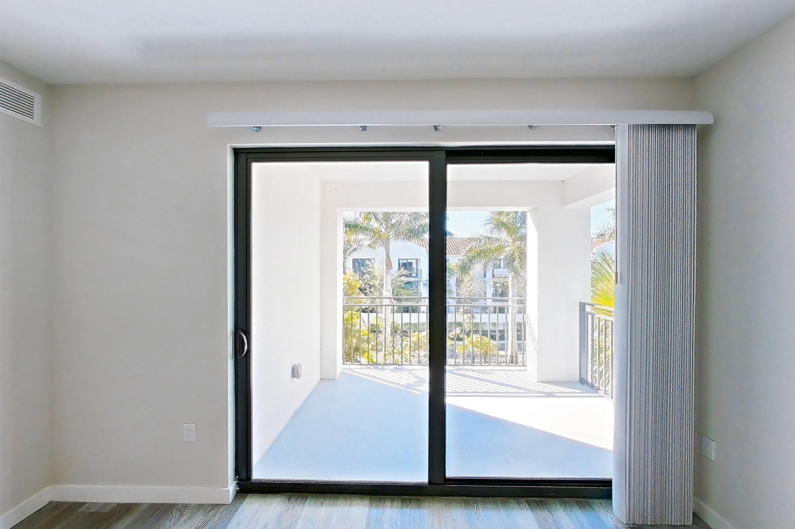 Living room with light wood-finish flooring, Apartment 02-303 at Cortland South Kendall