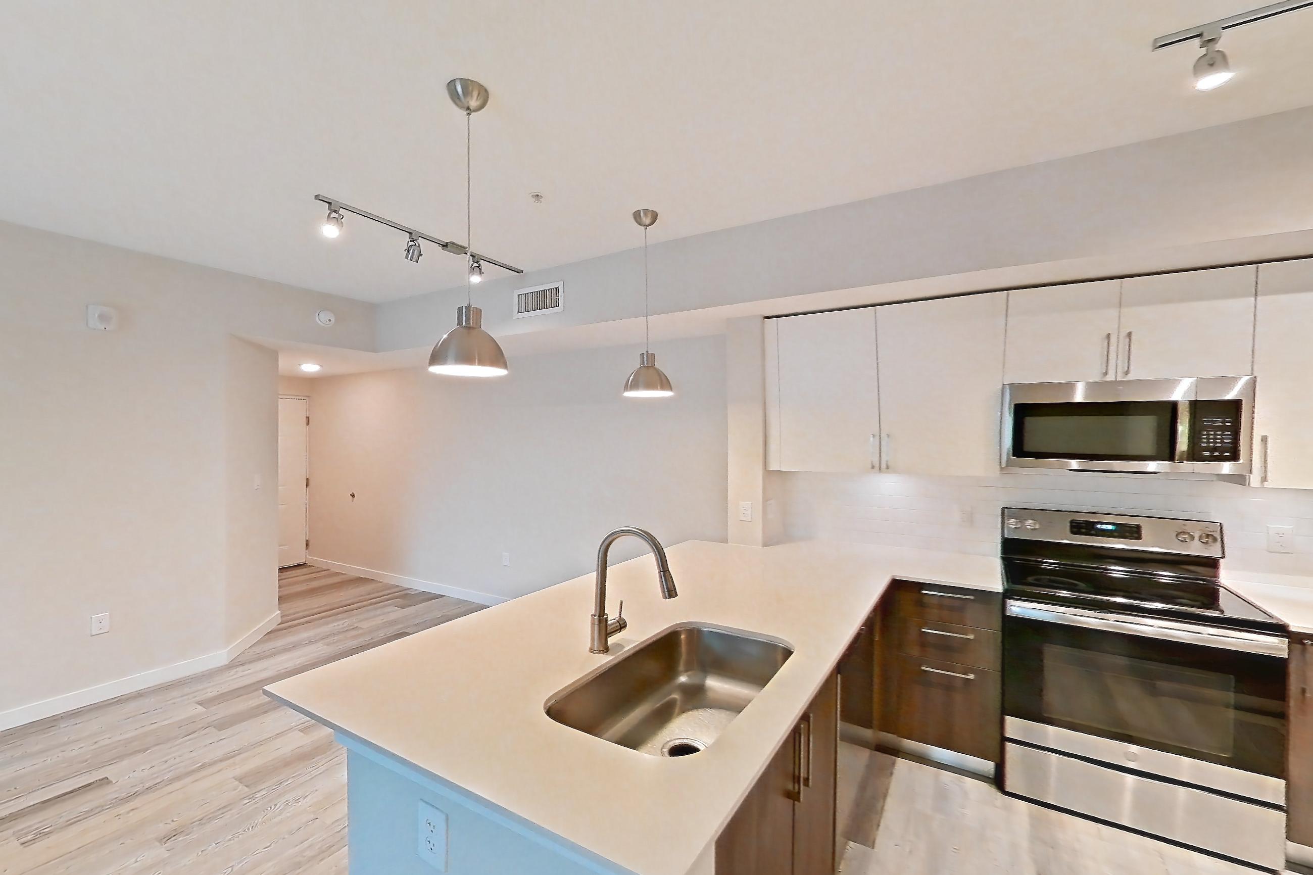 Kitchen entryway in Apartment 17-308 at Cortland South Kendall, C1 - Rock Ridge floor plan