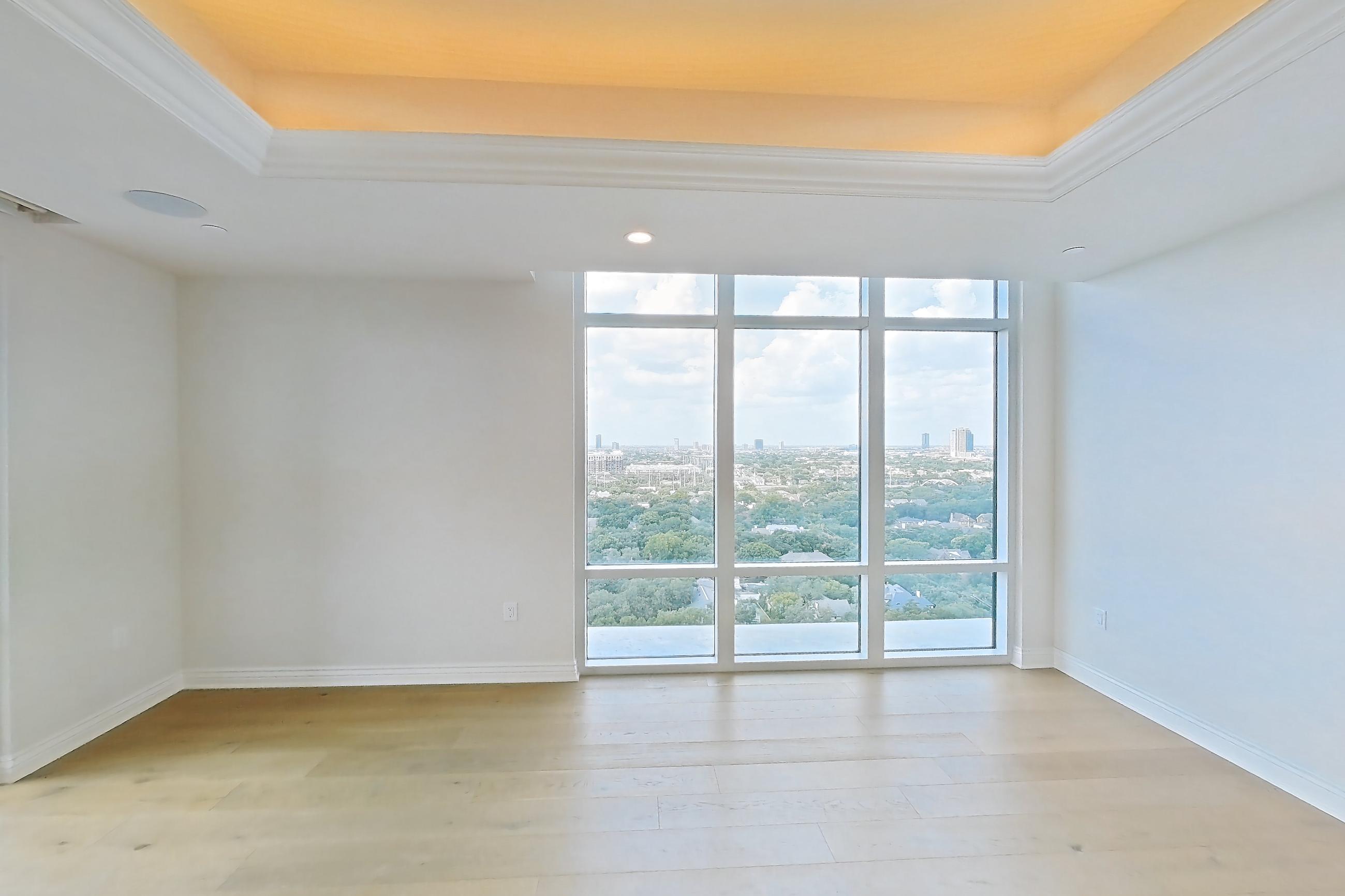 Living room with light wood-finish flooring and wood-finish flooring, Apartment 1807 at The Langley