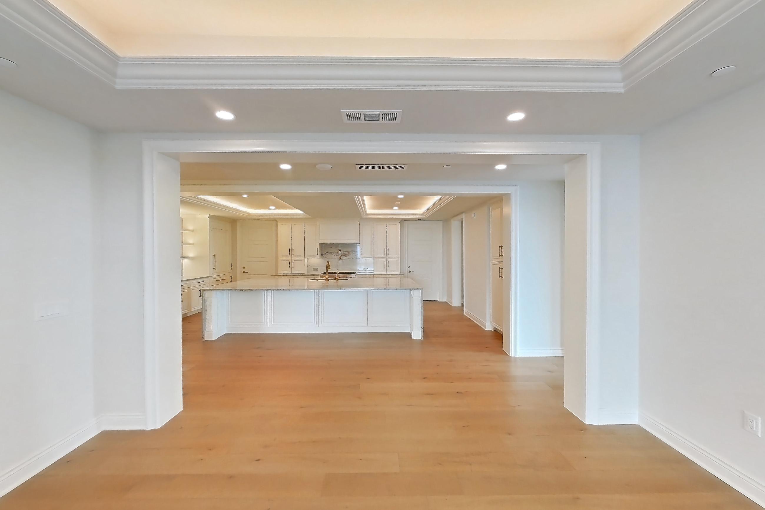 Living space 3 with light wood-finish flooring and wood-finish flooring, Apartment 1807 at The Langley