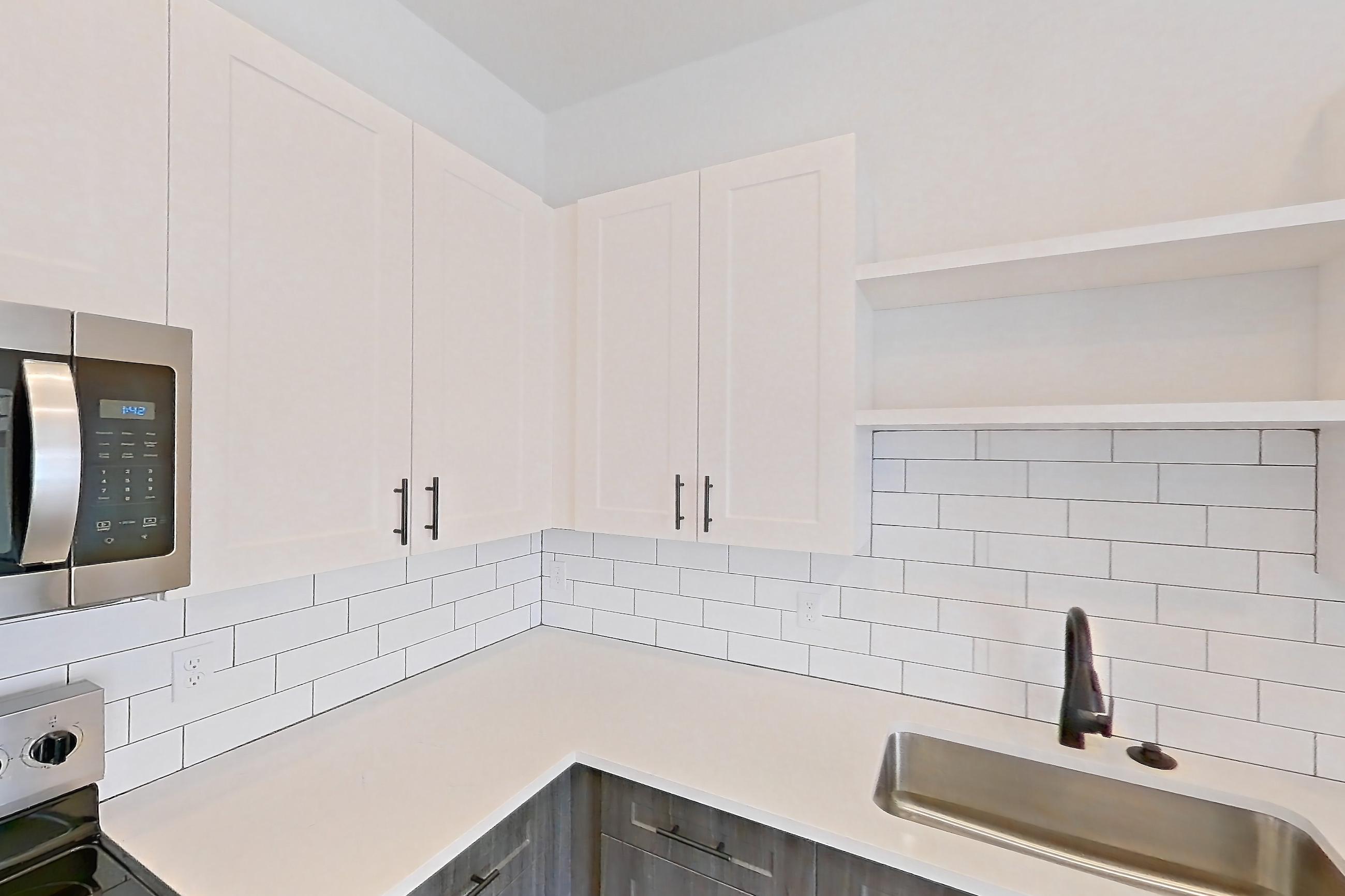 Kitchen in Apartment 09-306 at Marlon at Central Park, 1E floor plan