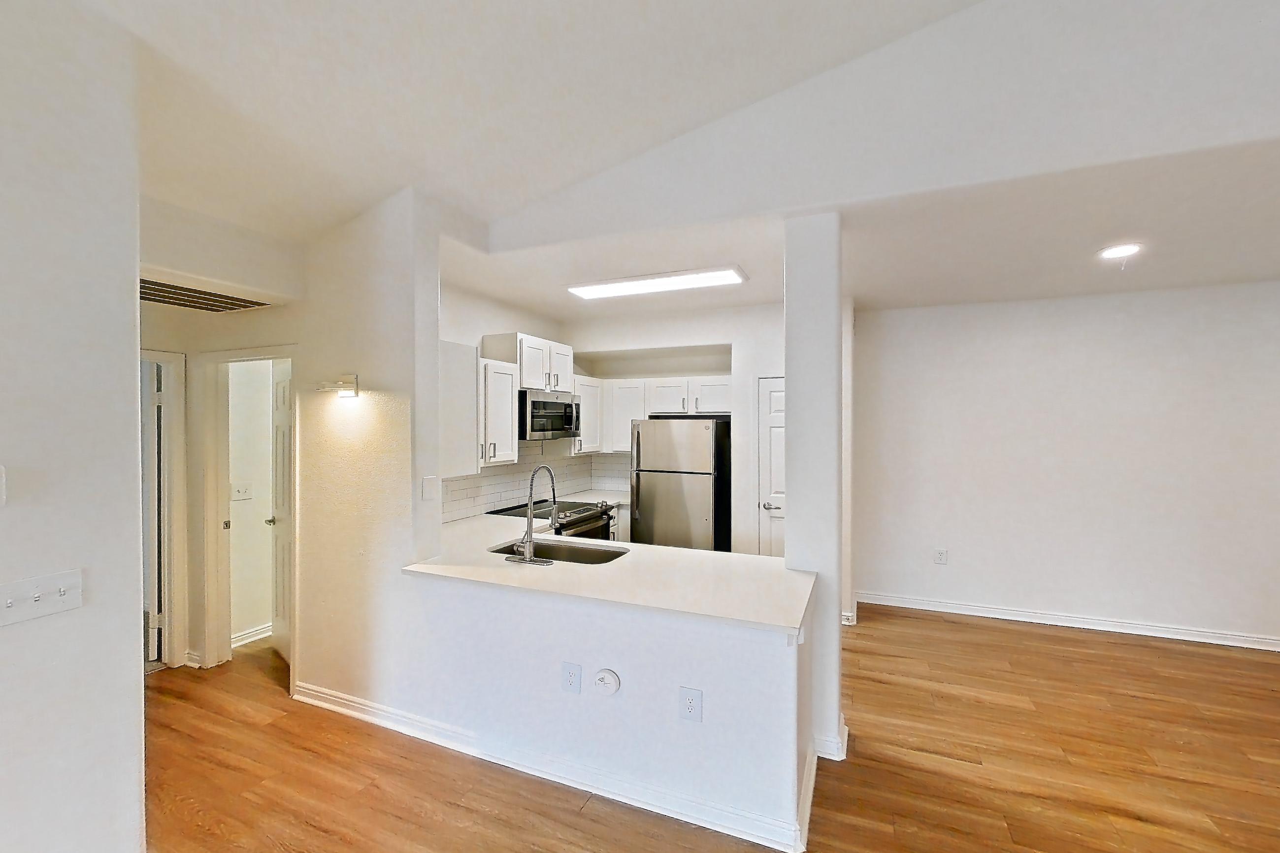 Living space in a 1E floor plan apartment, representative of Apartment 10-204 at Eagle Ridge