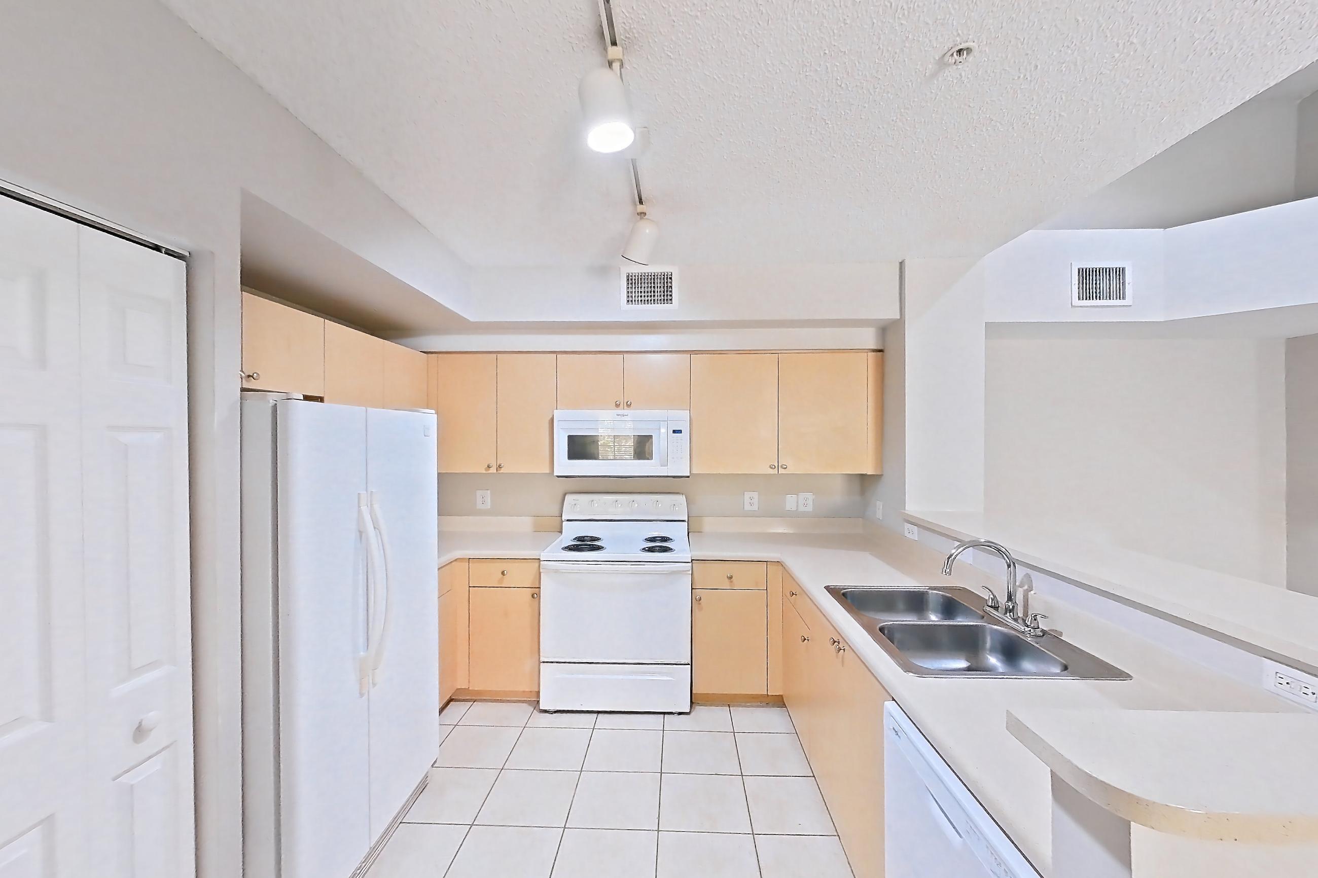 Kitchen entryway, Apartment 04-304 at Miramar Lakes