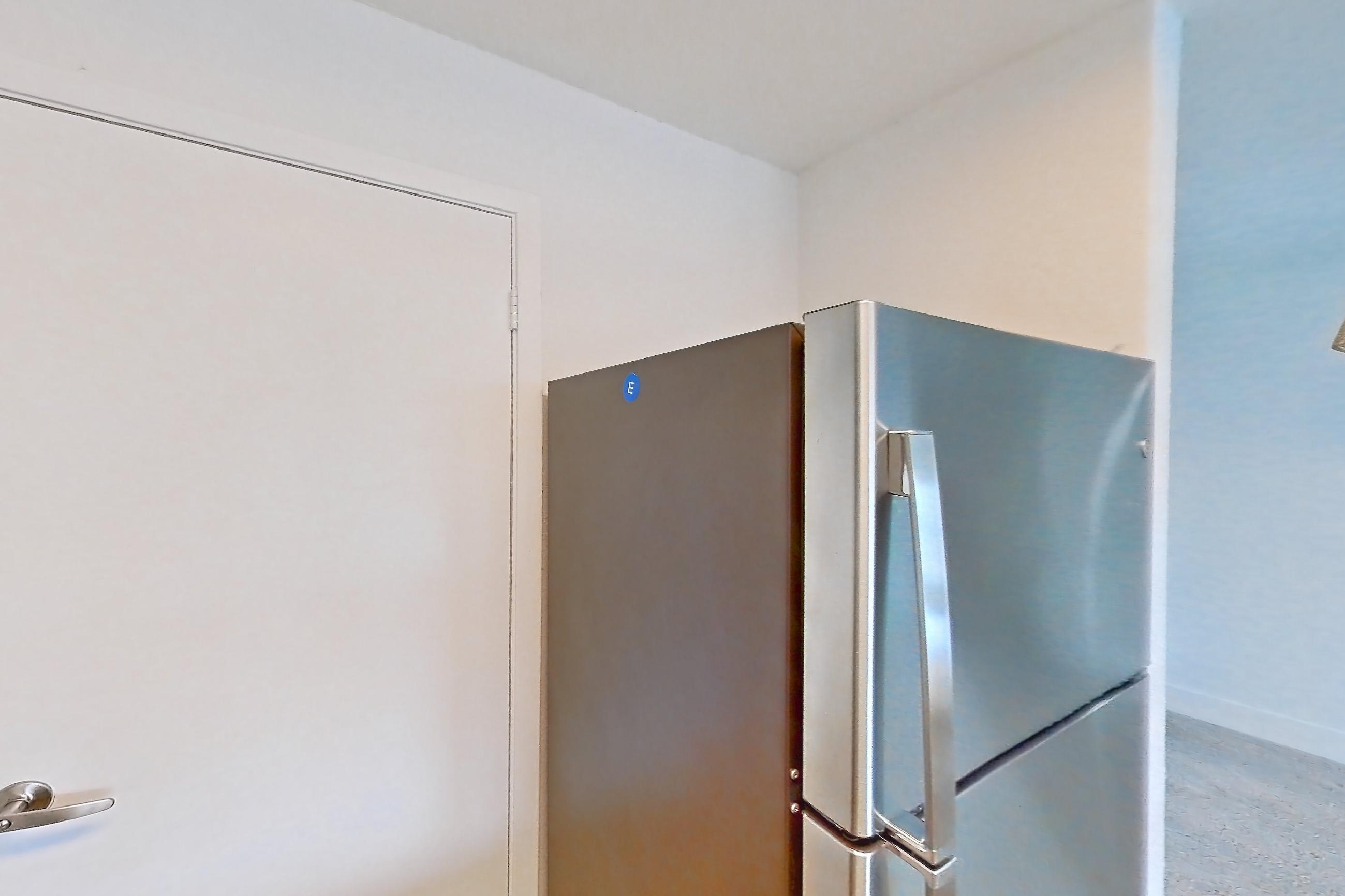Kitchen in a 1B floor plan apartment, representative of Apartment 10-0916 at Brookwood Club