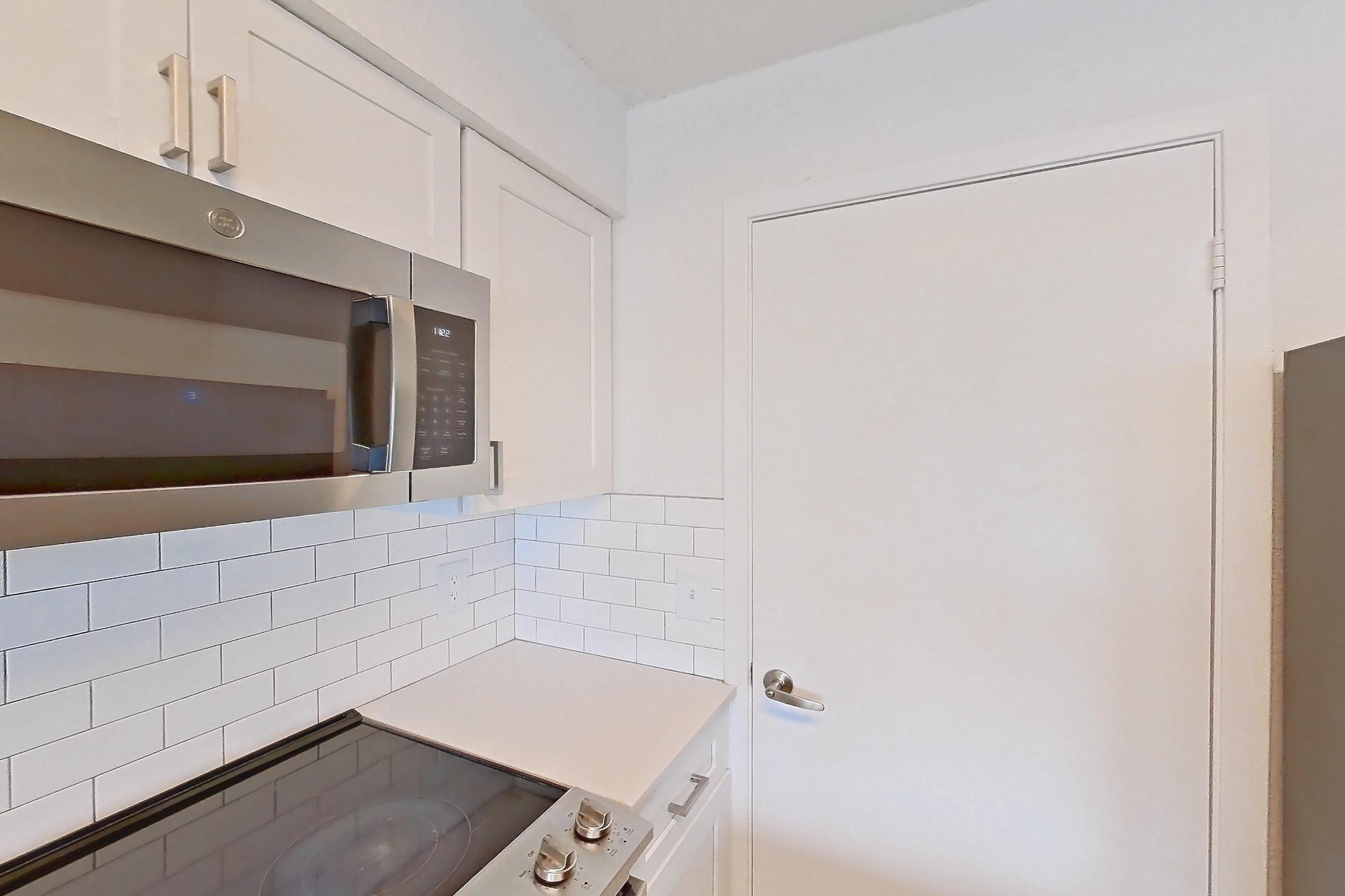 Kitchen in a 1B floor plan apartment, representative of Apartment 10-0916 at Brookwood Club