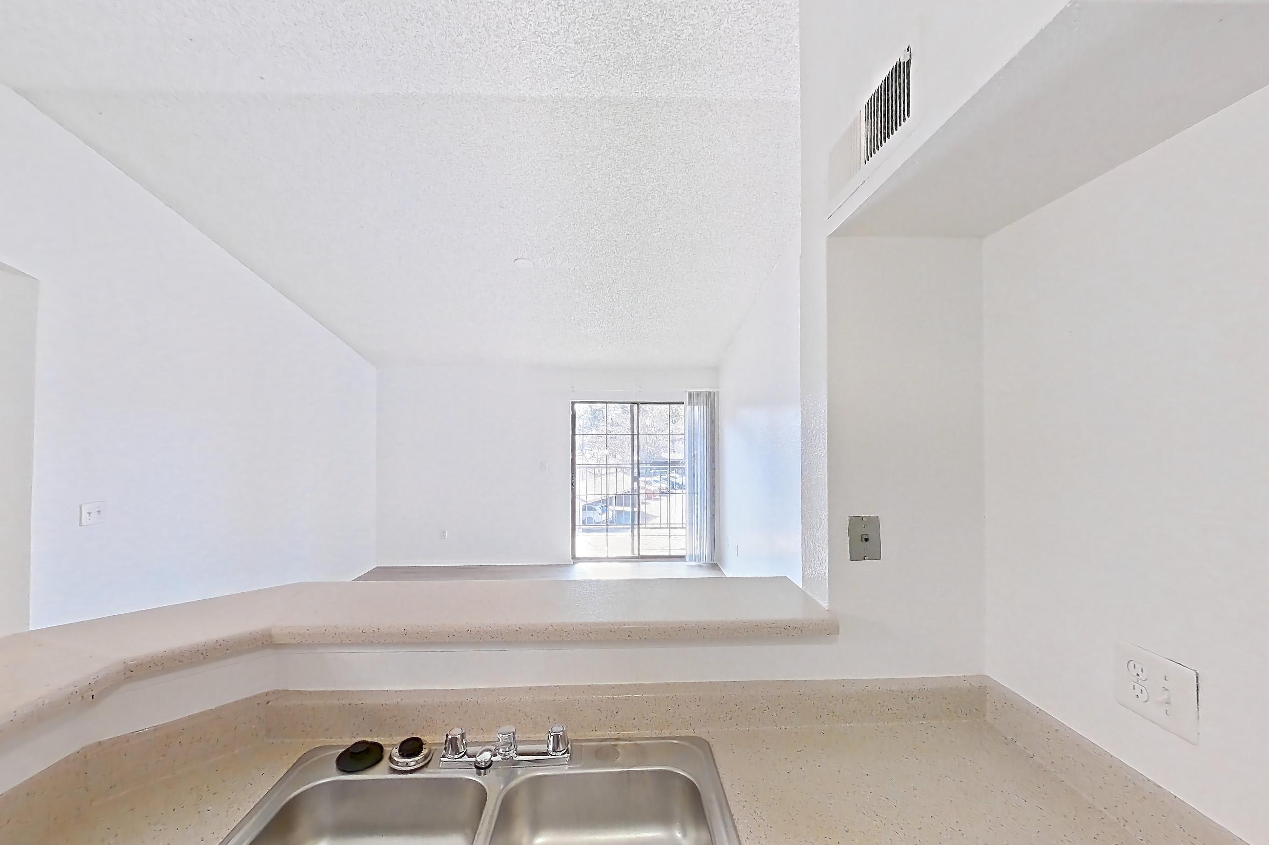 Kitchen with dishwasher, electric range, light stone countertops, light wood-finish flooring, microwave, oven/range, refrigerator, and white appliances, Apartment 4137 at Canyon Chase