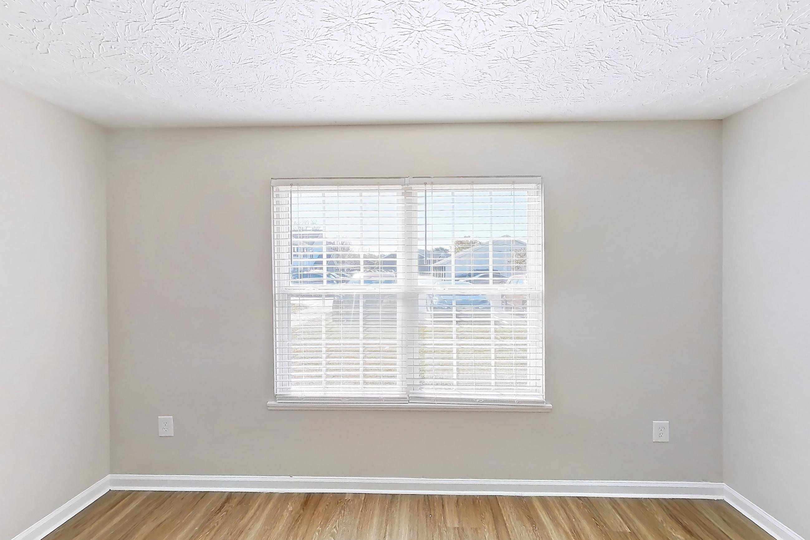 Living room with light wood-finish flooring, Apartment 2728CLD at The Gardens Columbus