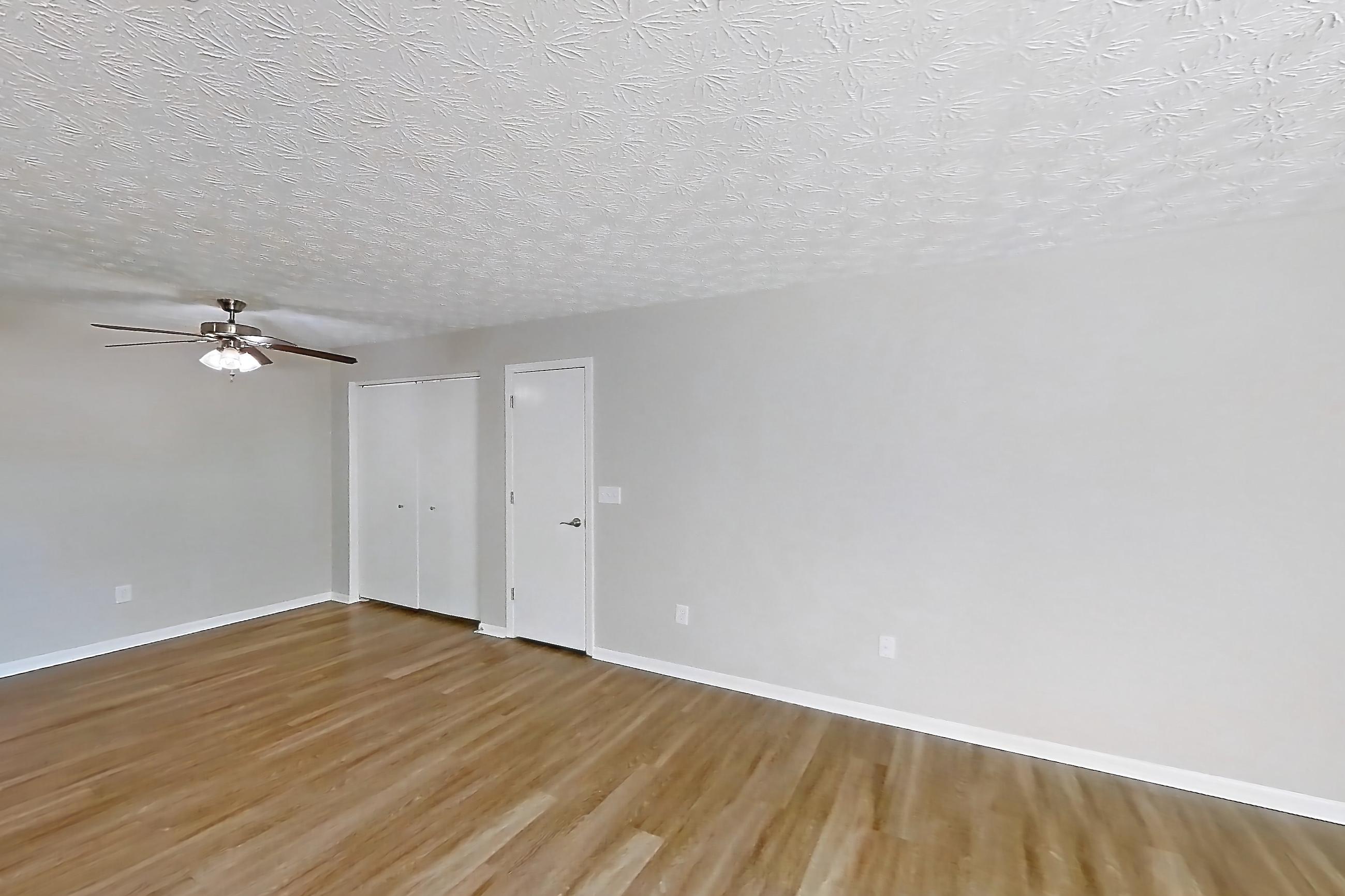 Living room with dark wood-finish flooring and light wood-finish flooring, Apartment 3152BLD at The Gardens Columbus