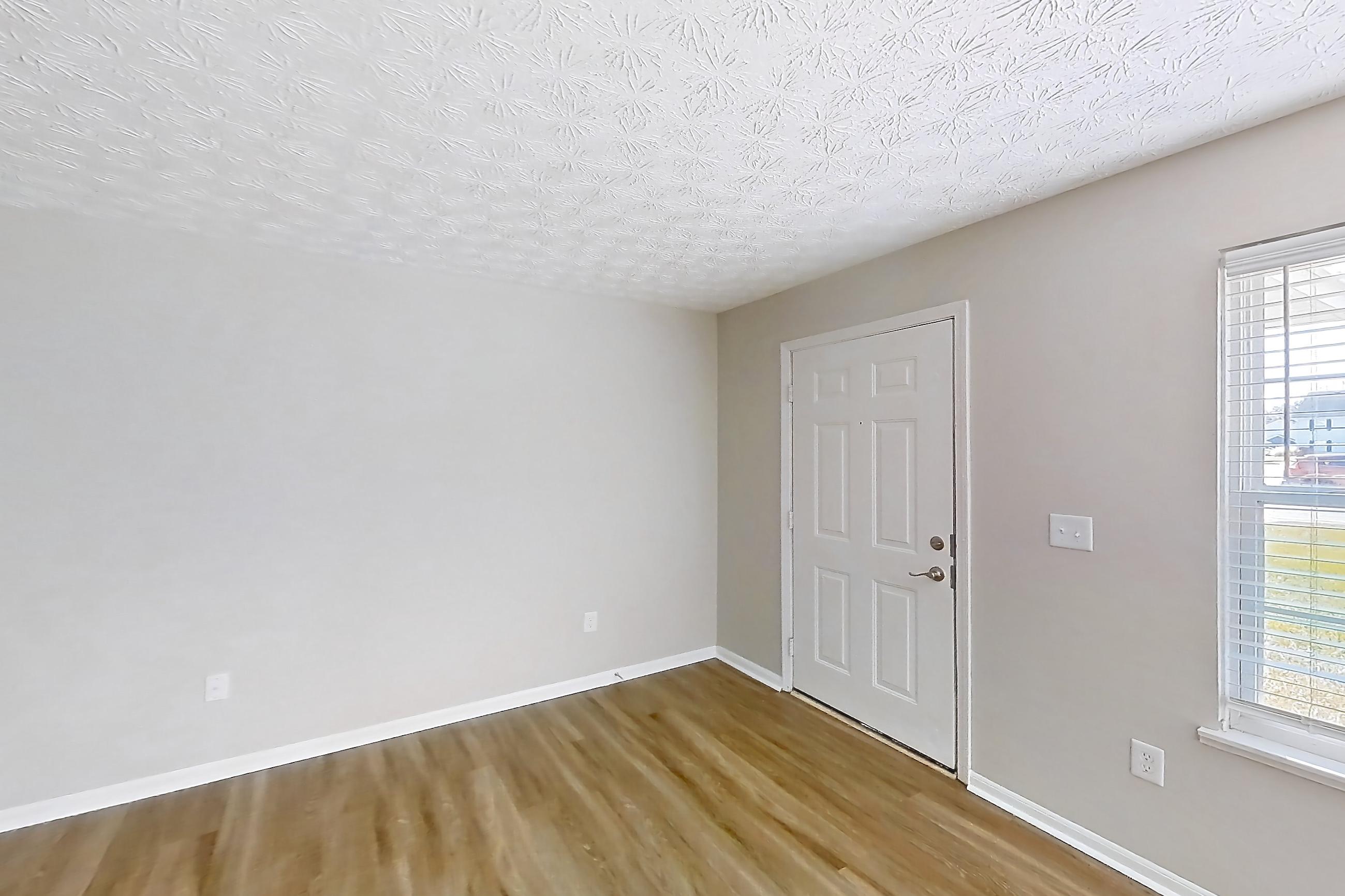 Living room with dark wood-finish flooring and light wood-finish flooring, Apartment 3152BLD at The Gardens Columbus