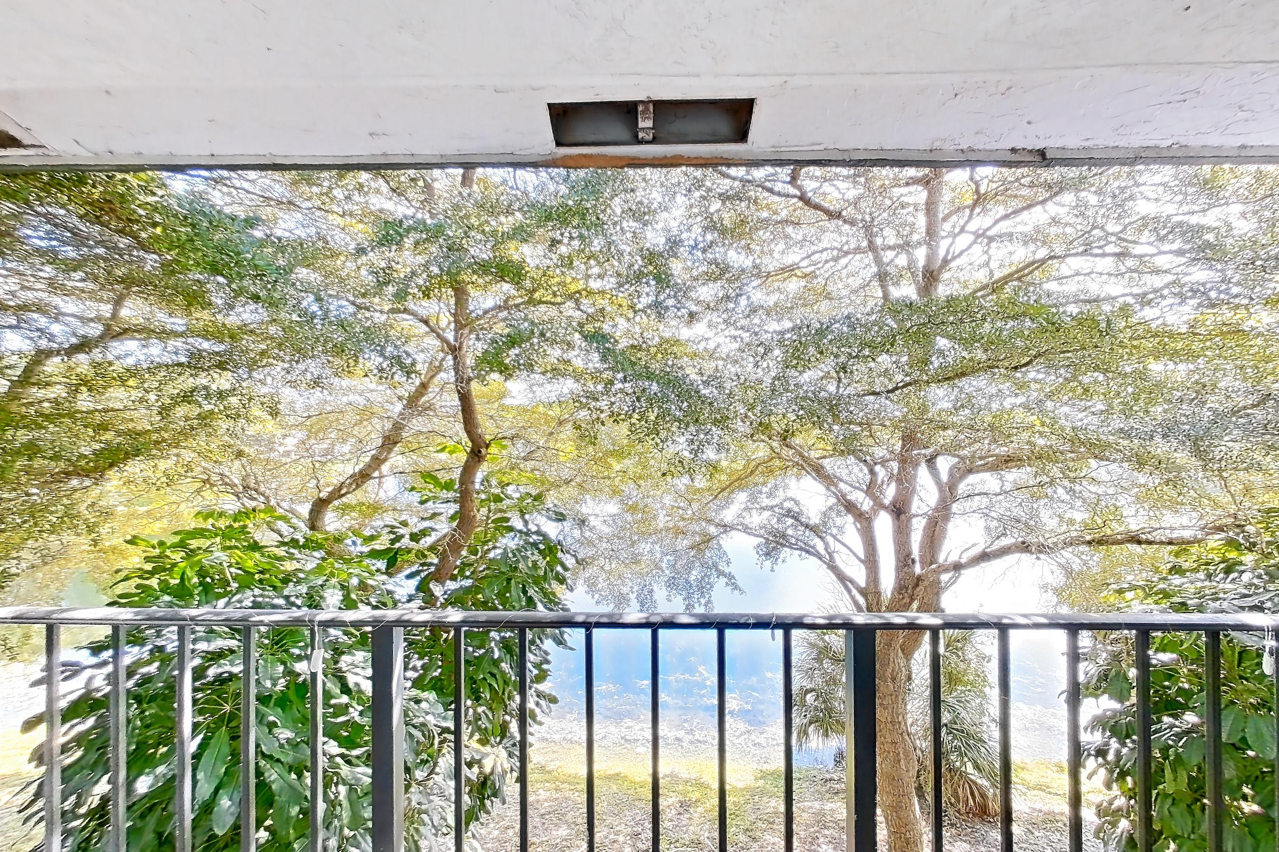 Living room balcony with water view, Apartment 15-033 at The Reserve at Ashley Lake