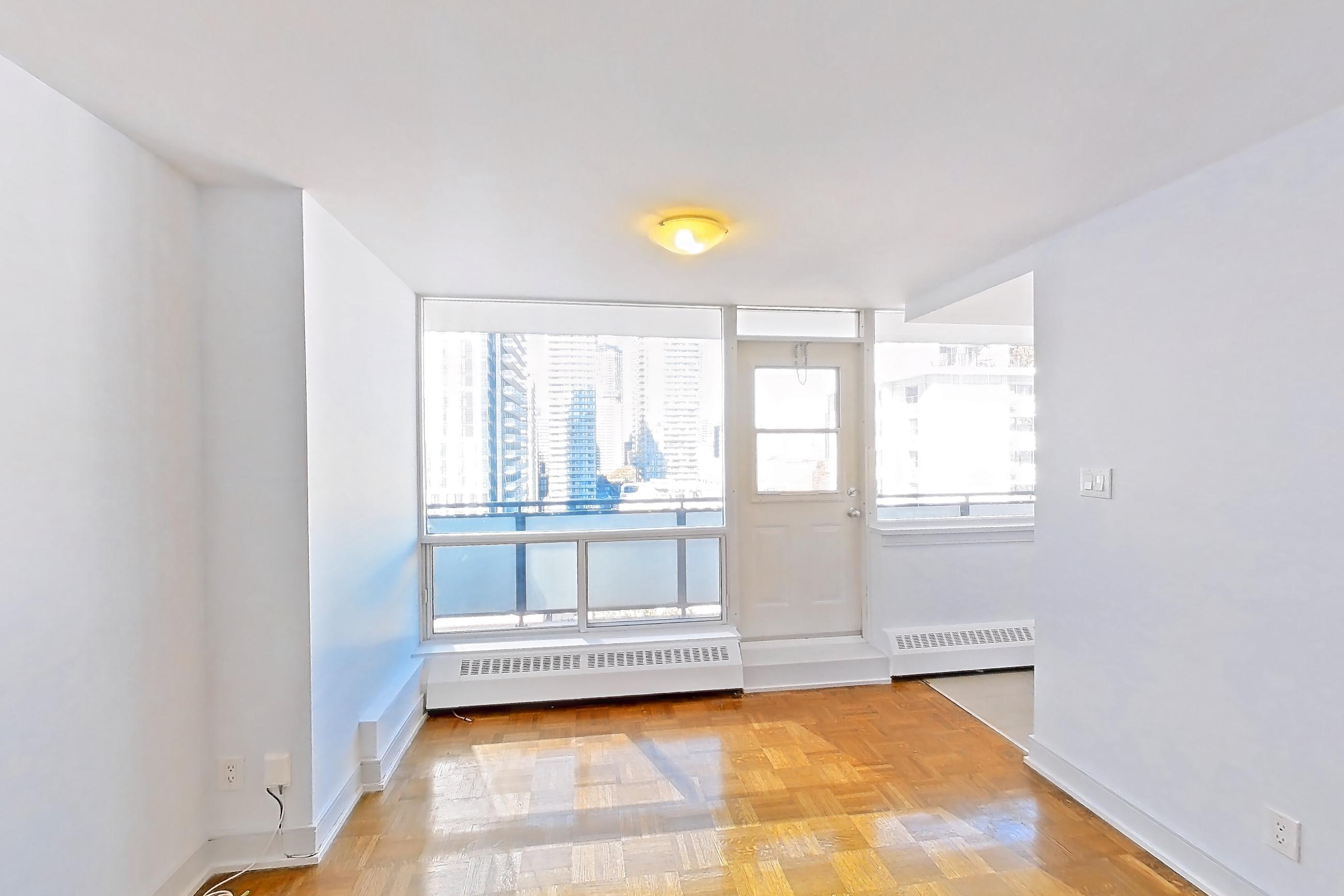 Living space with baseboard heating, light wood-finish flooring, and parquet flooring, Apartment 1-1714 at Village Green