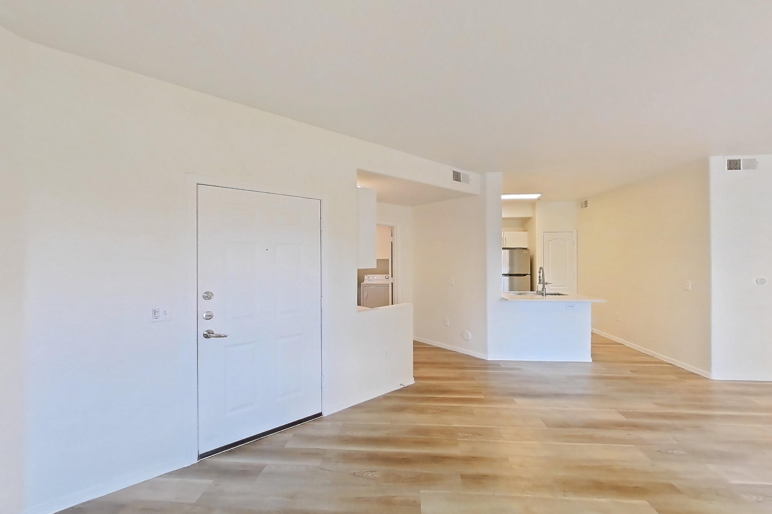 Living room with light wood-finish flooring, Apartment 1035 at Dobson 2222