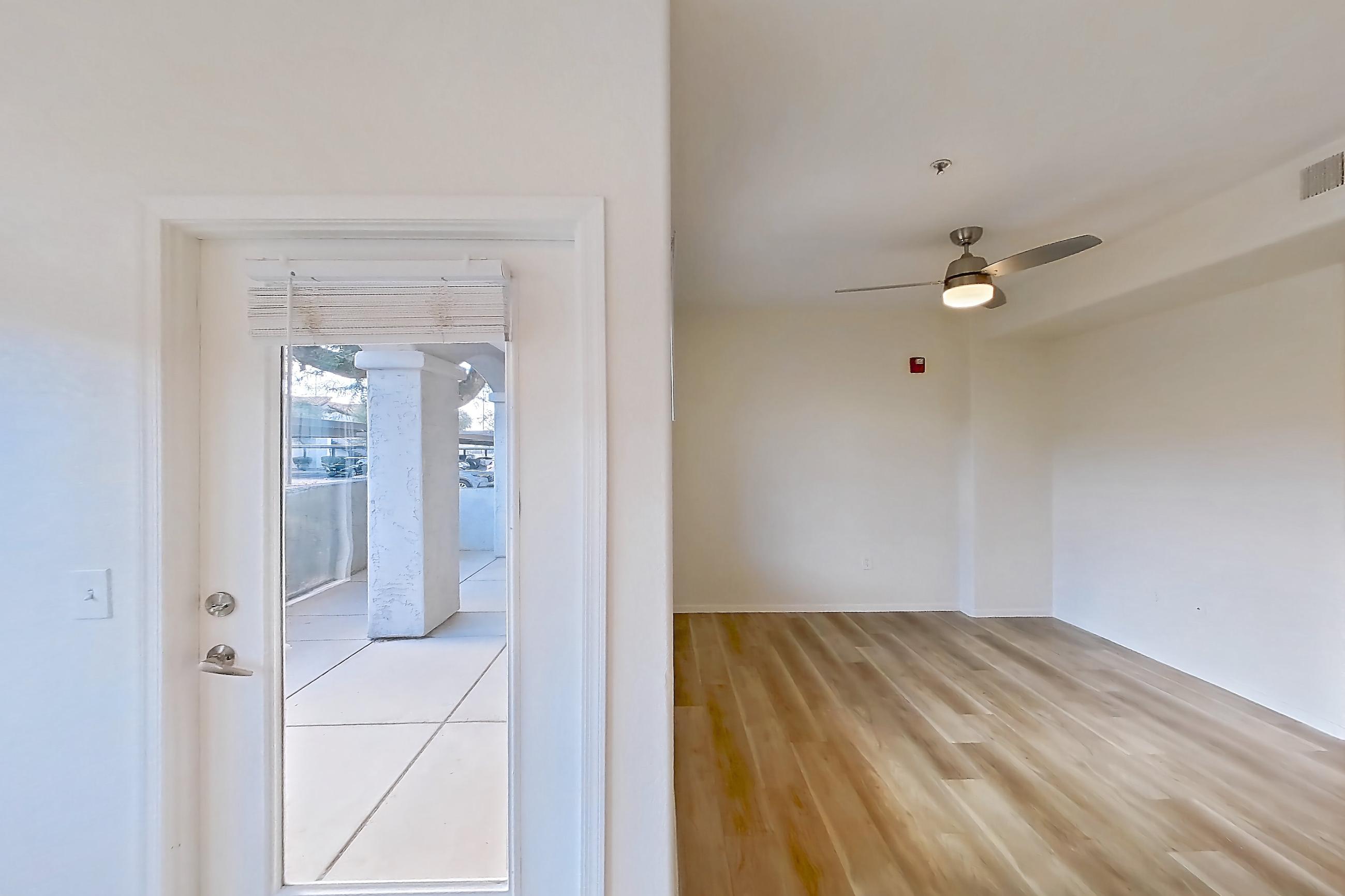Dining room with light wood-finish flooring, Apartment 1087 at Dobson 2222