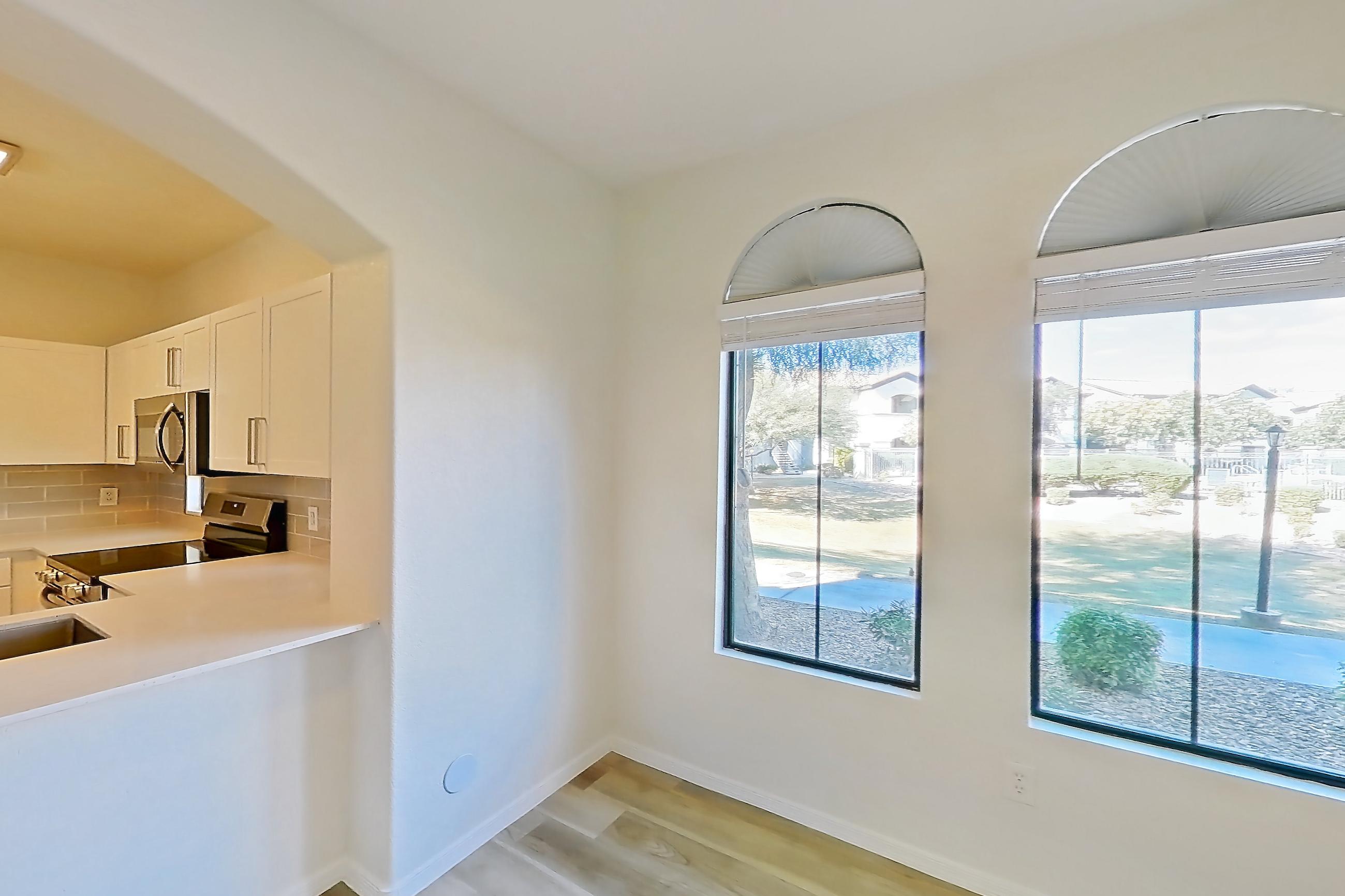 Dining room with light wood-finish flooring, Apartment 1091 at Dobson 2222