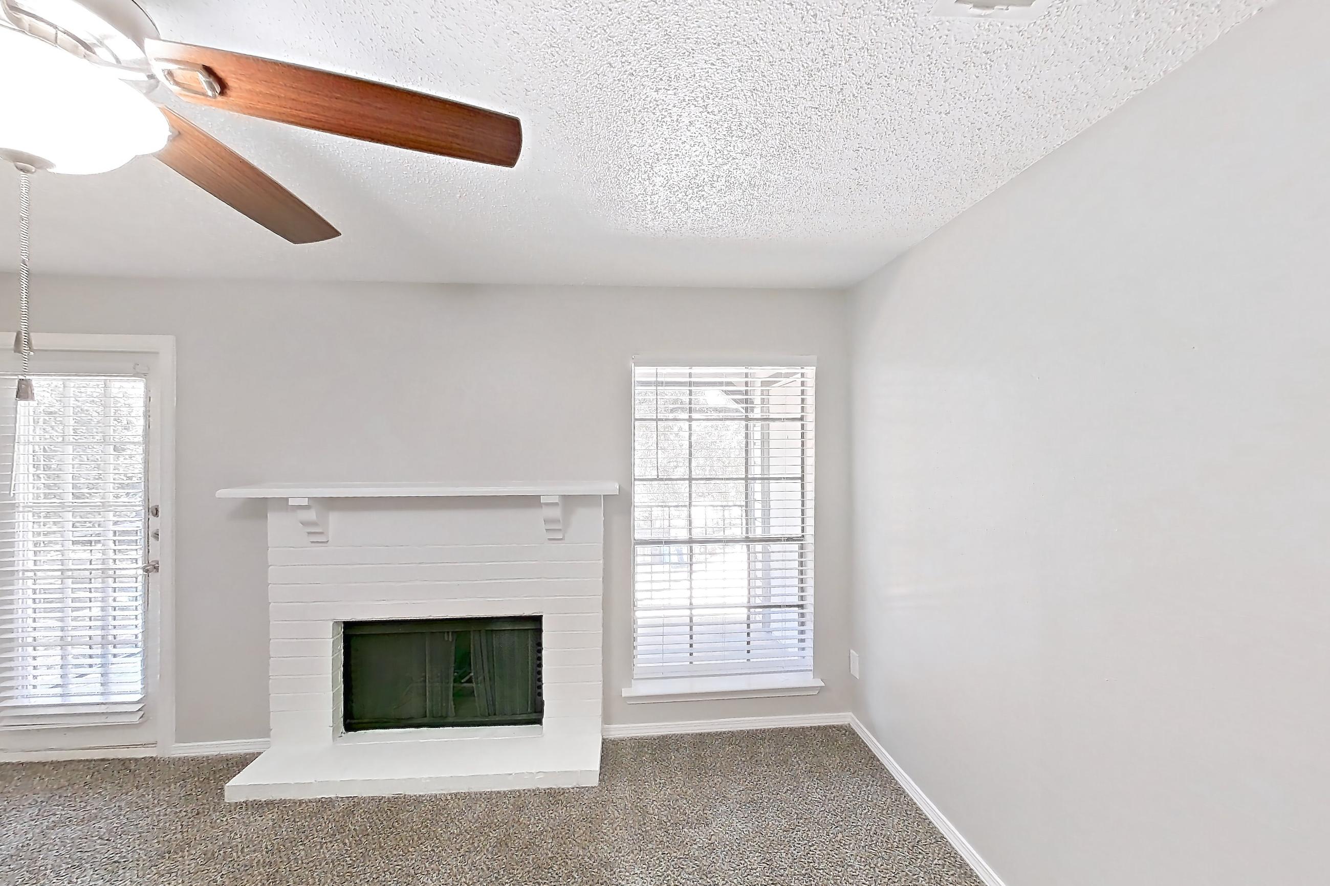 Living room with fireplace, Apartment 322 at Arbor Creek